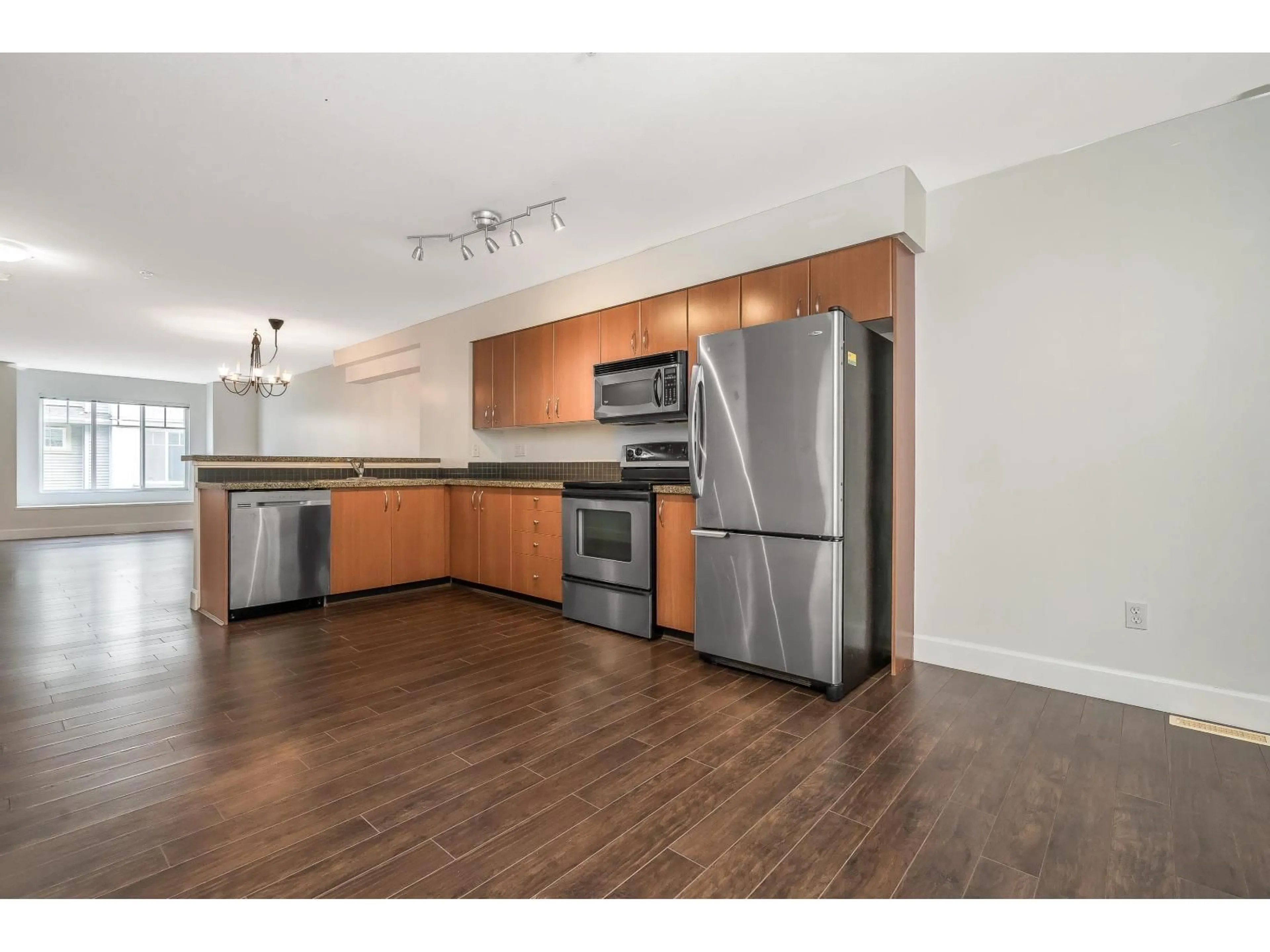 Open concept kitchen, wood/laminate floor for #77 - 12040 68, Surrey British Columbia V3W1P5