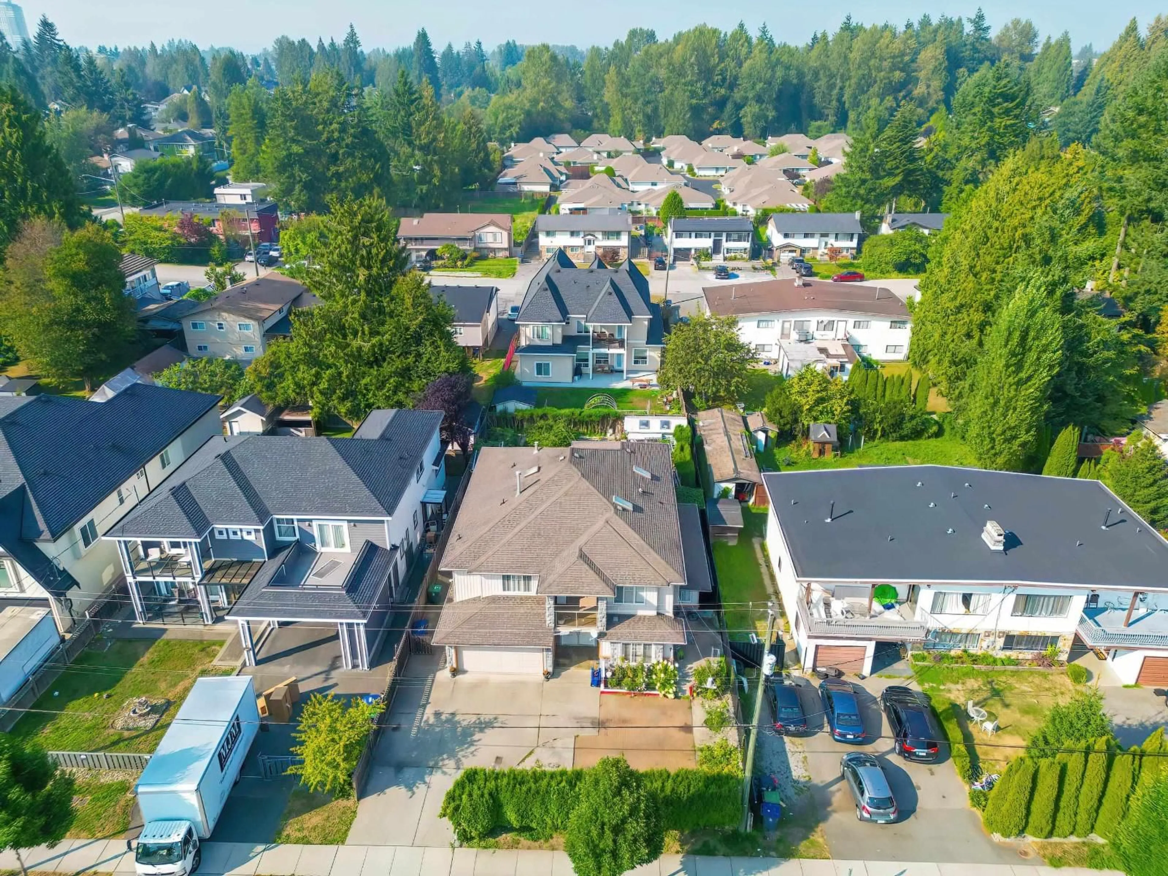 A pic from outside/outdoor area/front of a property/back of a property/a pic from drone, street for 14149 100A, Surrey British Columbia V3T1K6