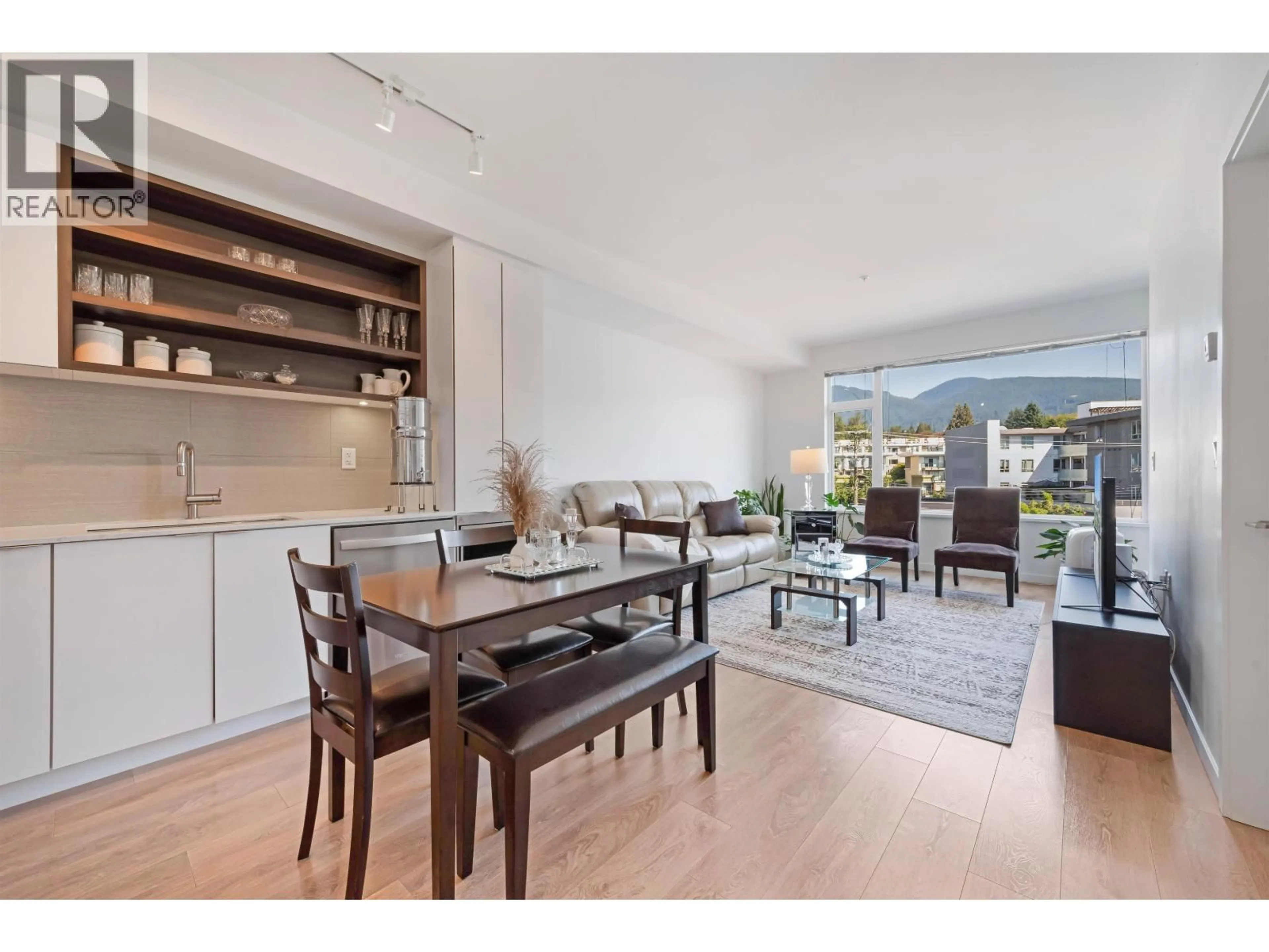 Open concept kitchen, wood/laminate floor for 303 - 725 MARINE DRIVE, Vancouver British Columbia V7M0G2