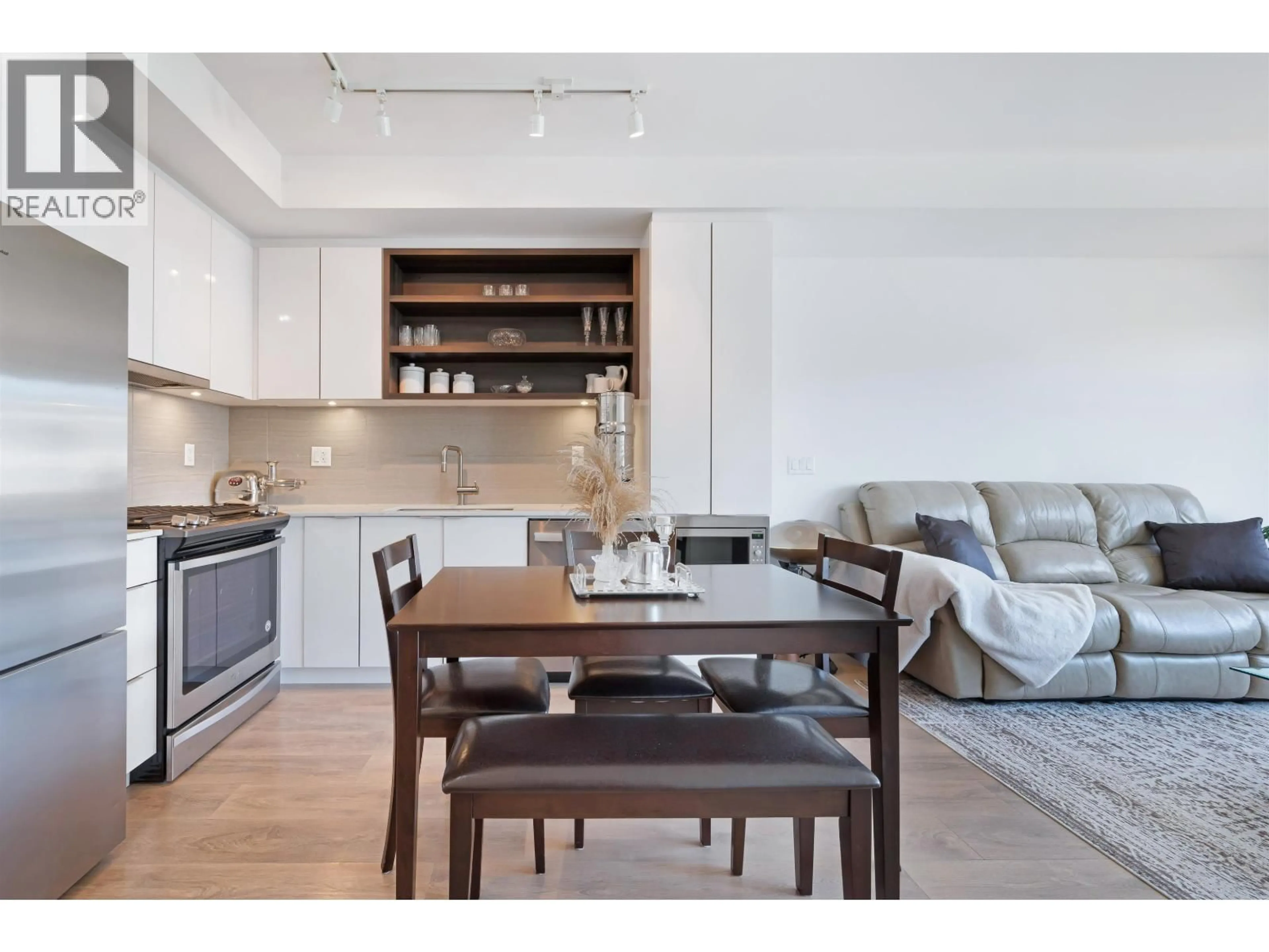 Open concept kitchen, wood/laminate floor for 303 - 725 MARINE DRIVE, Vancouver British Columbia V7M0G2