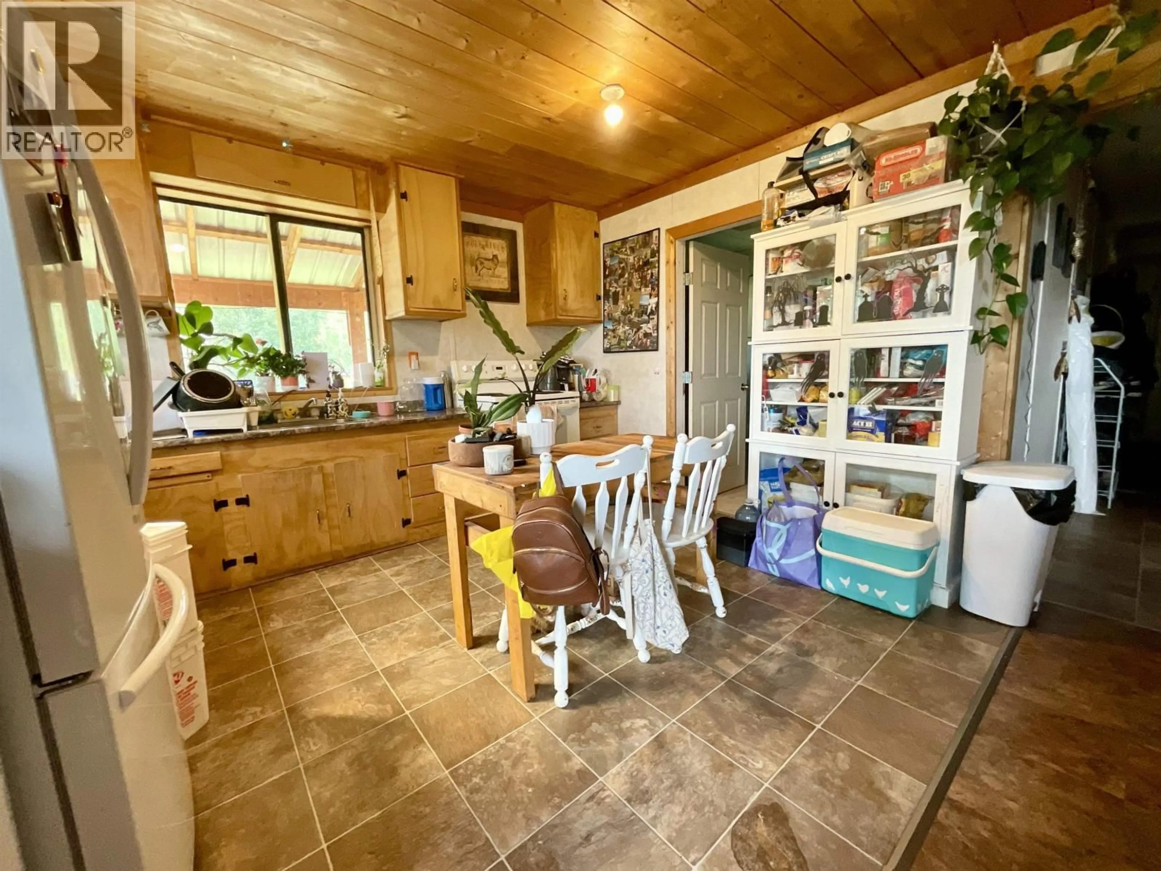 Rustic kitchen, ceramic/tile floor for 2100 TIBBLES ROAD, Quesnel British Columbia V2J3H9