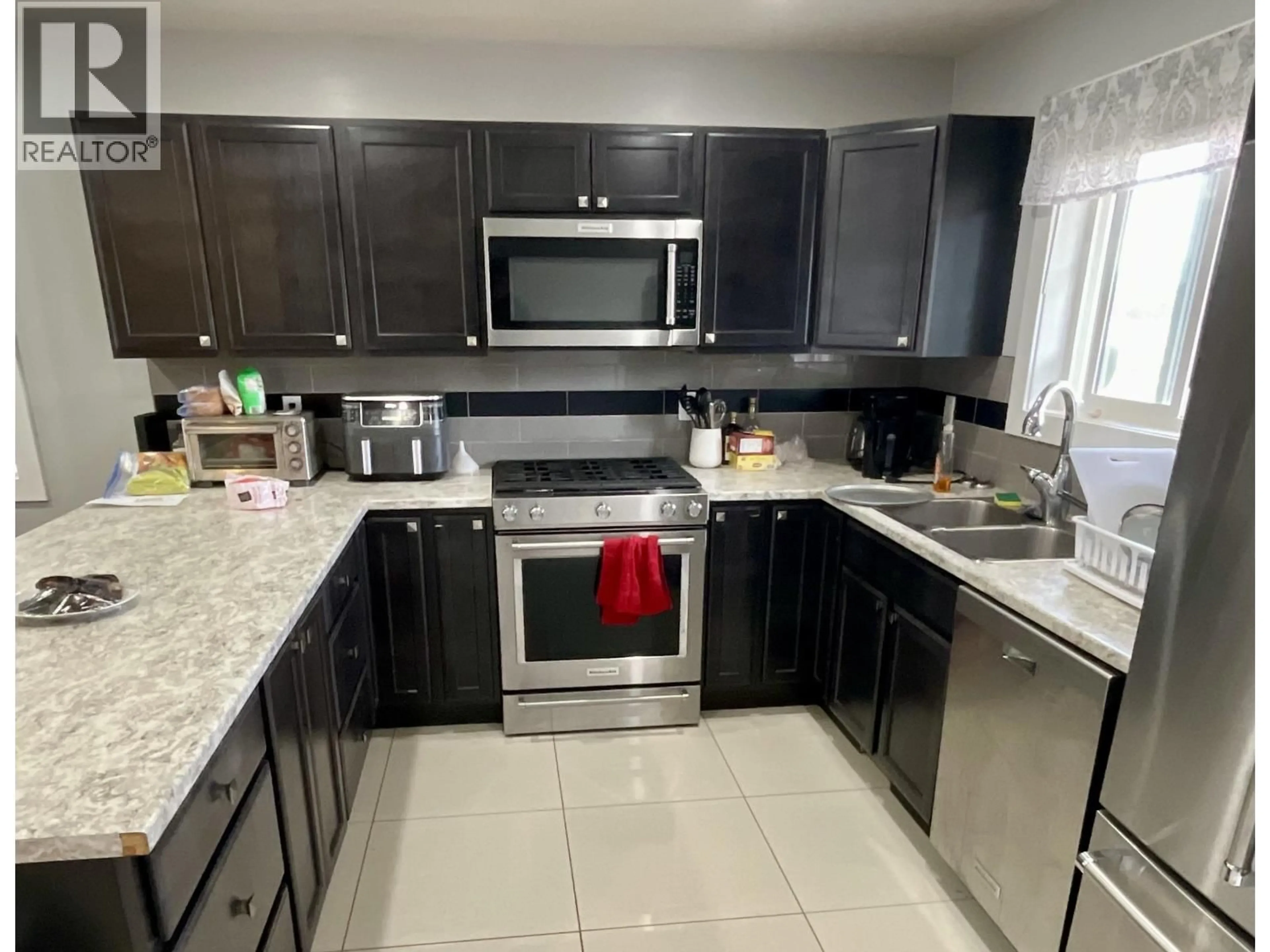 Standard kitchen, ceramic/tile floor for 8617 74 STREET, Fort St. John British Columbia V1J2Y5