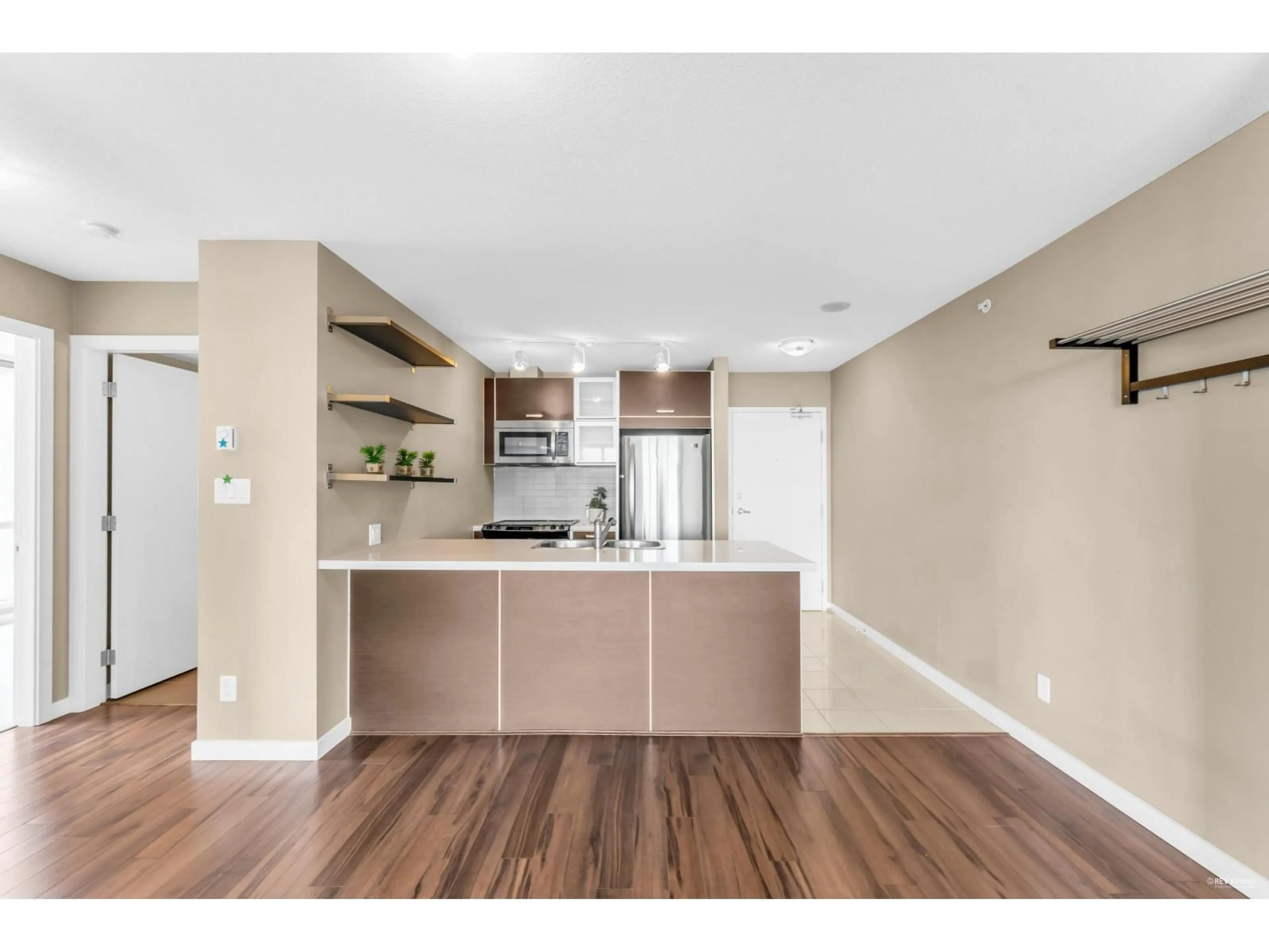 Open concept kitchen, wood/laminate floor for 2909 - 9981 WHALLEY, Surrey British Columbia V3T0H5