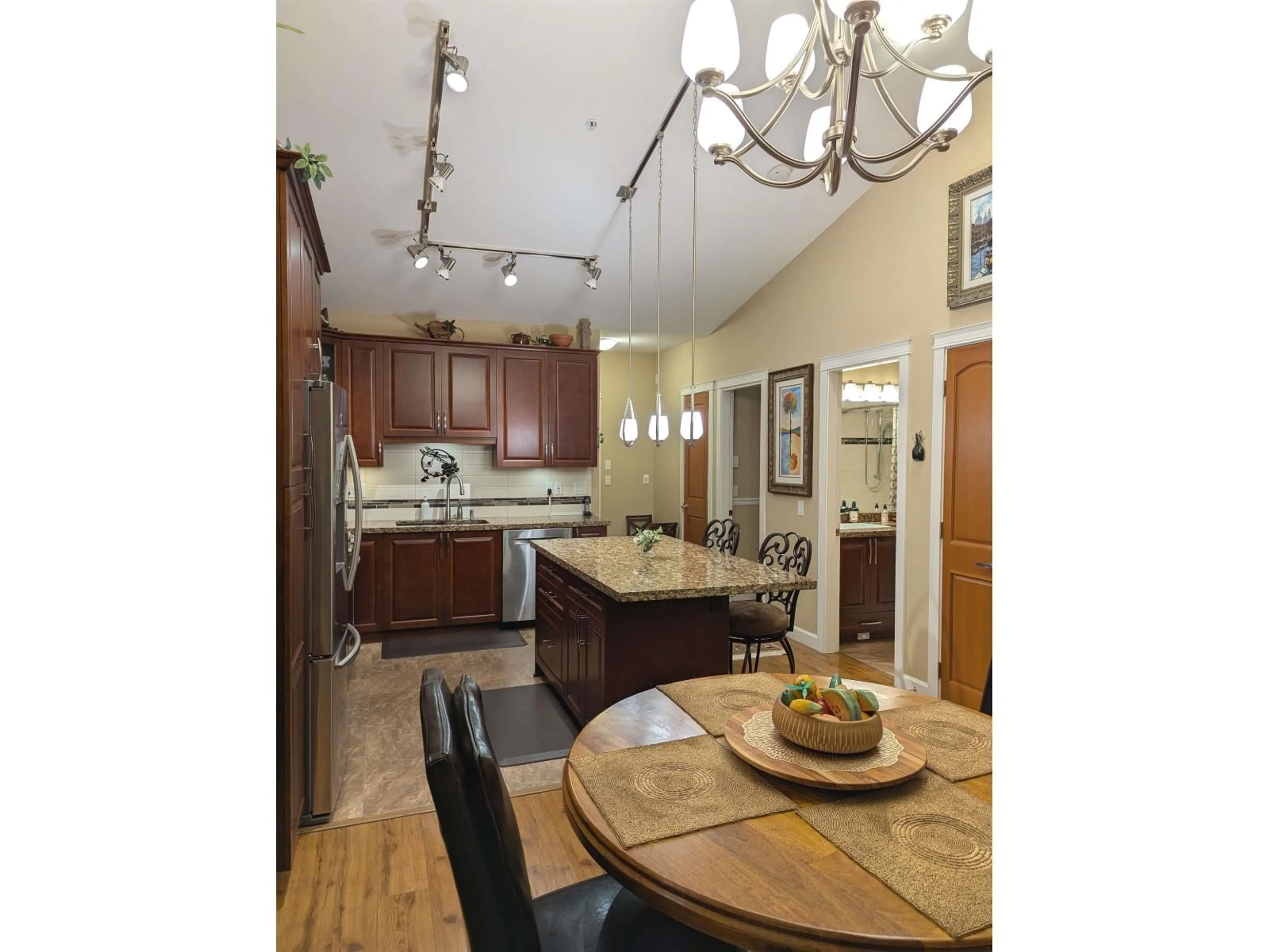 Open concept kitchen, wood/laminate floor for 625 - 8067 207, Langley British Columbia V2Y0P1