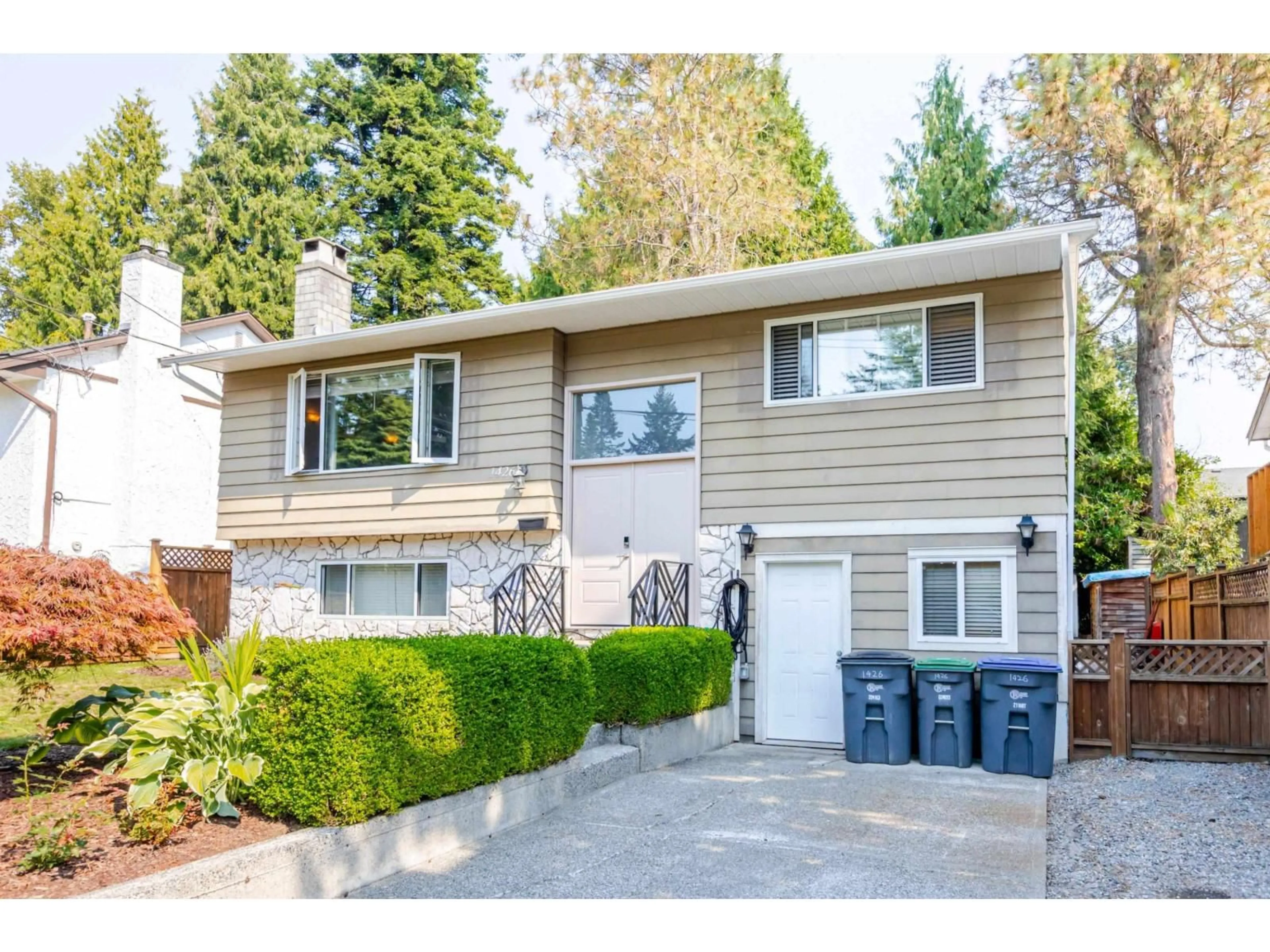 Home with vinyl exterior material, street for 1426 128A, Surrey British Columbia V4A3X4