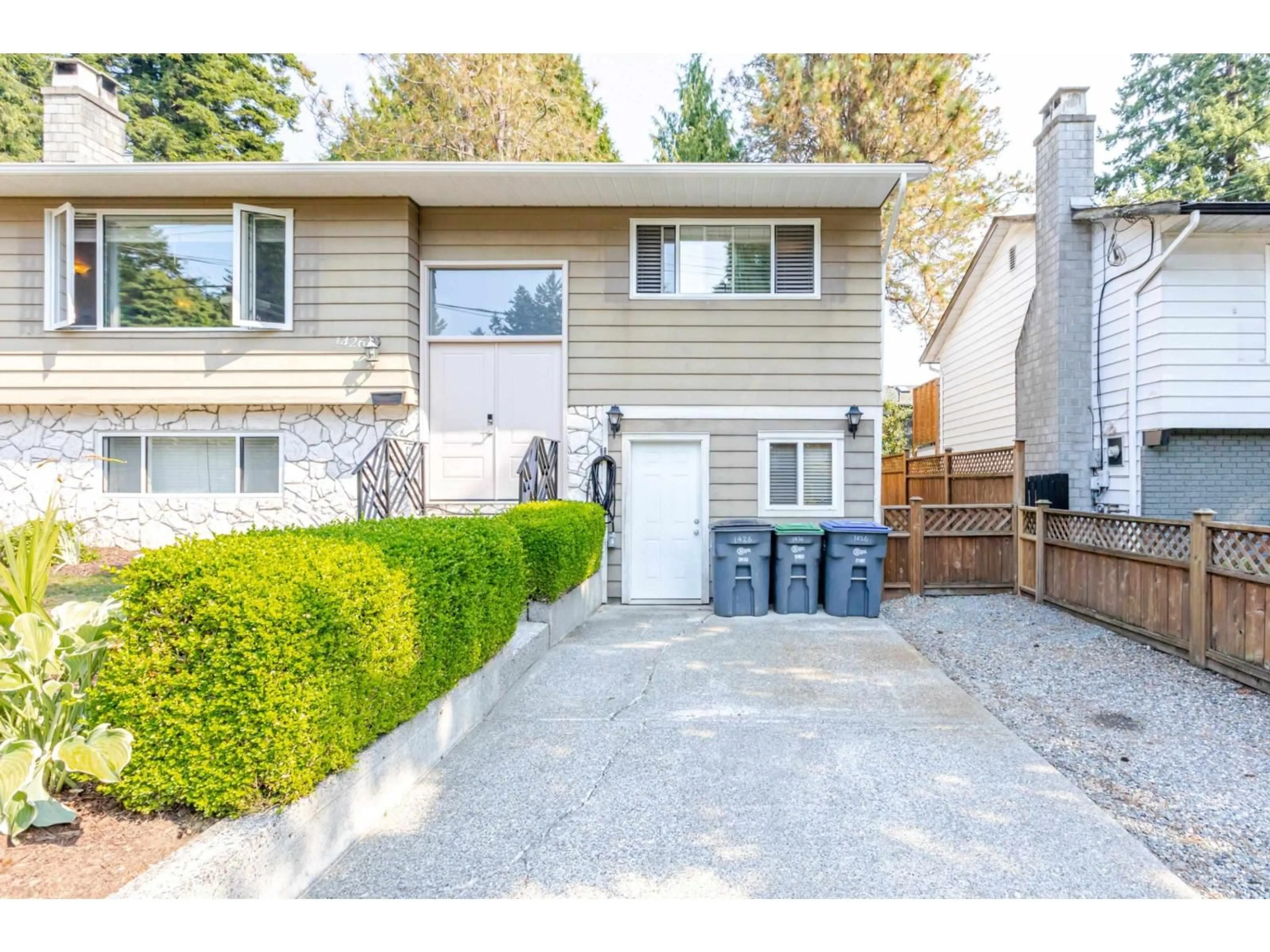 Home with vinyl exterior material, street for 1426 128A, Surrey British Columbia V4A3X4