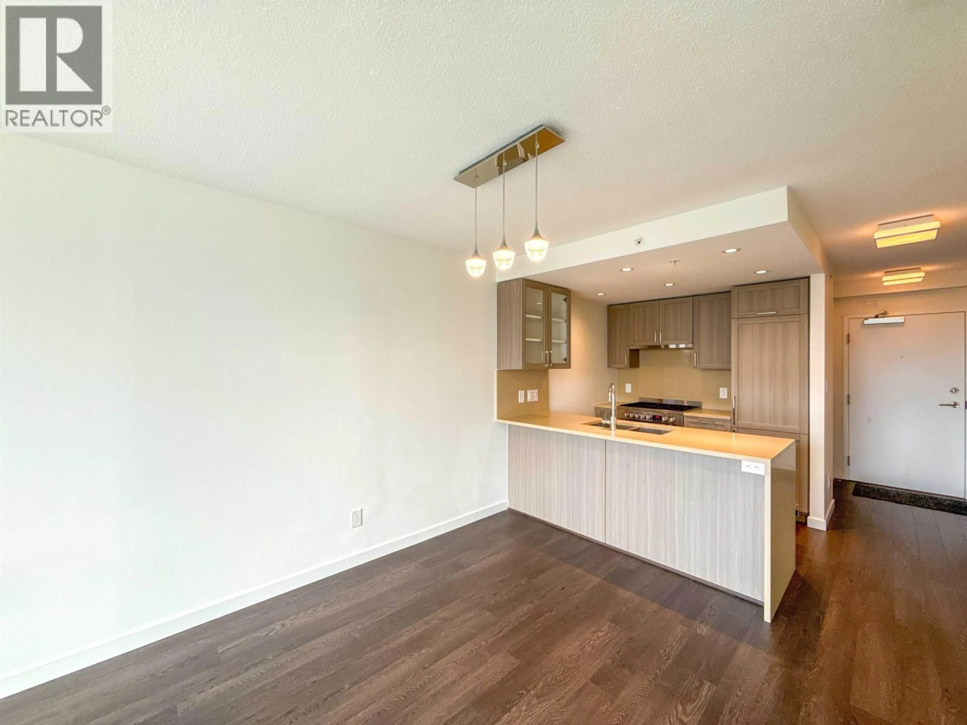Open concept kitchen, wood/laminate floor for 512 - 5598 ORMIDALE STREET, Vancouver British Columbia V5R0E5