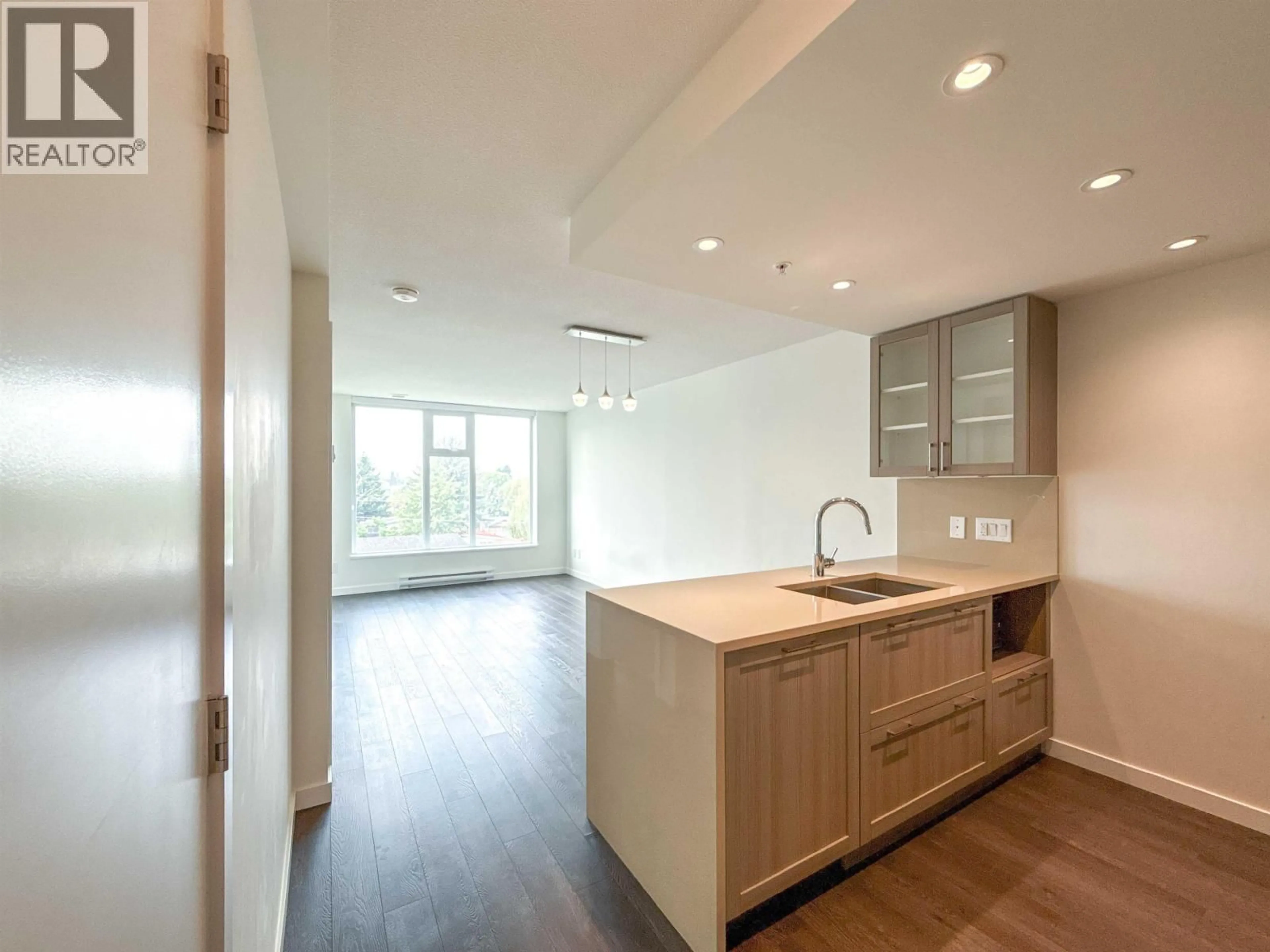 Open concept kitchen, wood/laminate floor for 512 - 5598 ORMIDALE STREET, Vancouver British Columbia V5R0E5