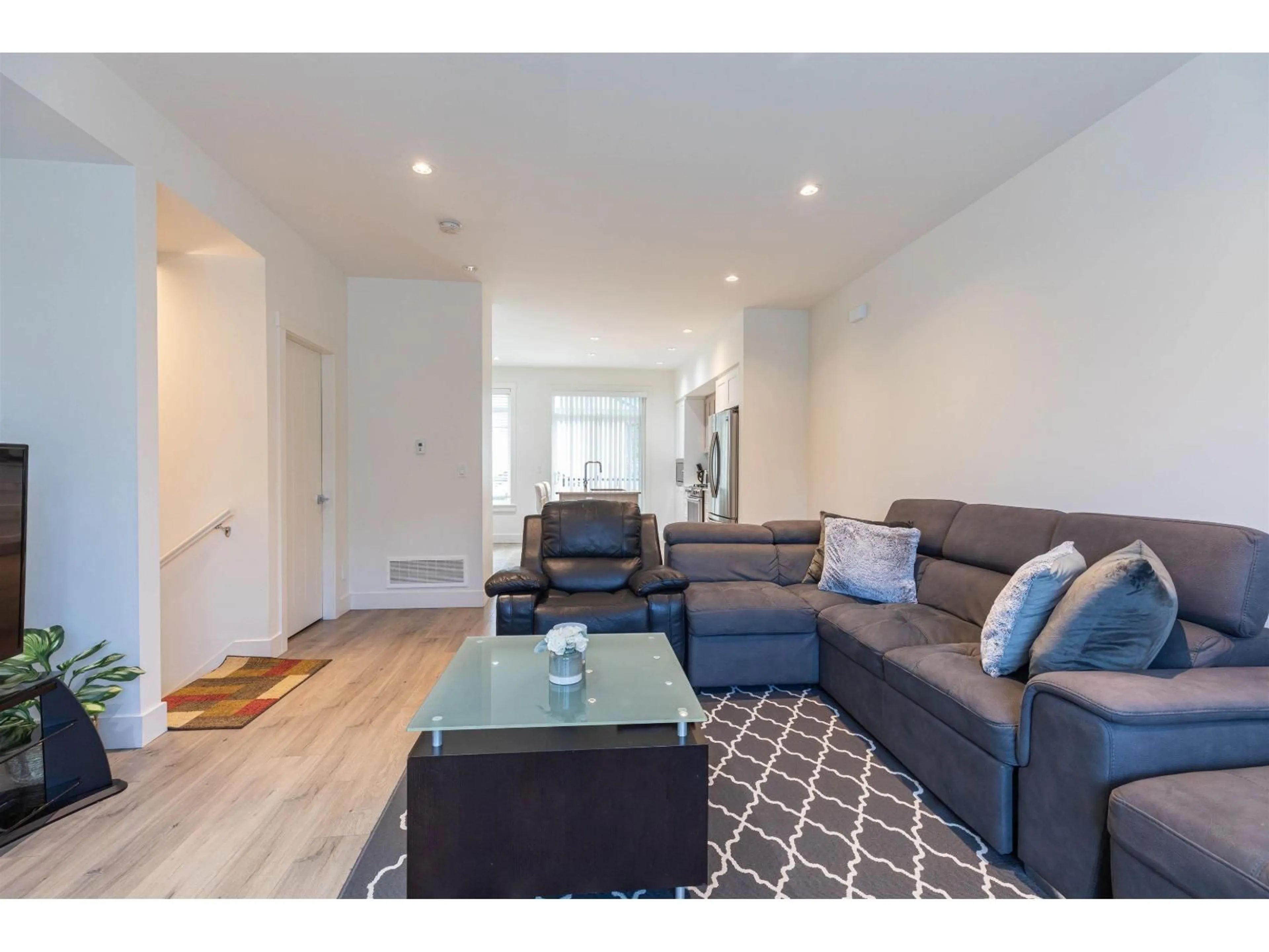 Living room with furniture, wood/laminate floor for 13 - 11188 72, Delta British Columbia V4E0A5