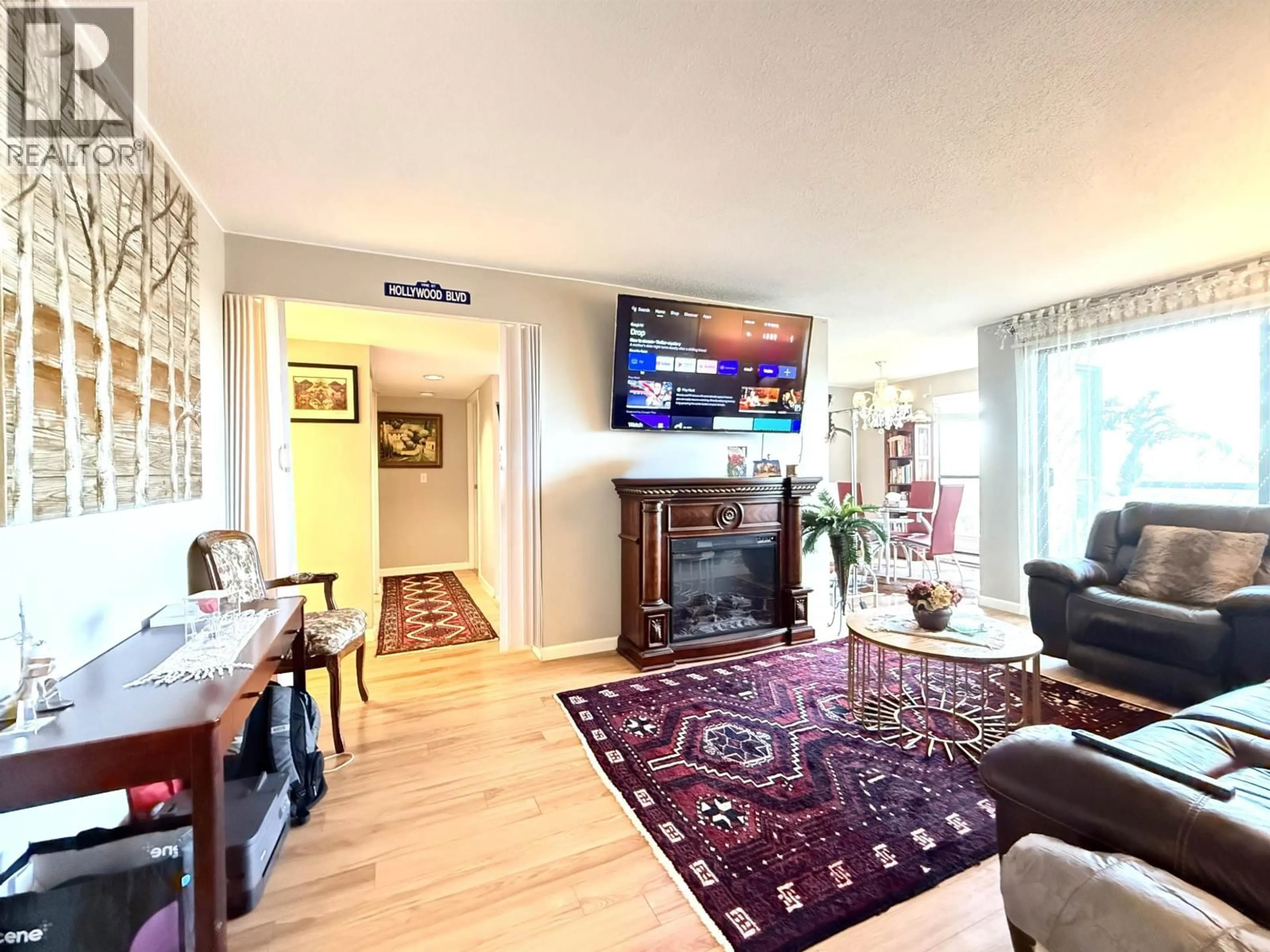 Living room with furniture, wood/laminate floor for 703 - 7040 GRANVILLE AVENUE, Richmond British Columbia V6Y3W5