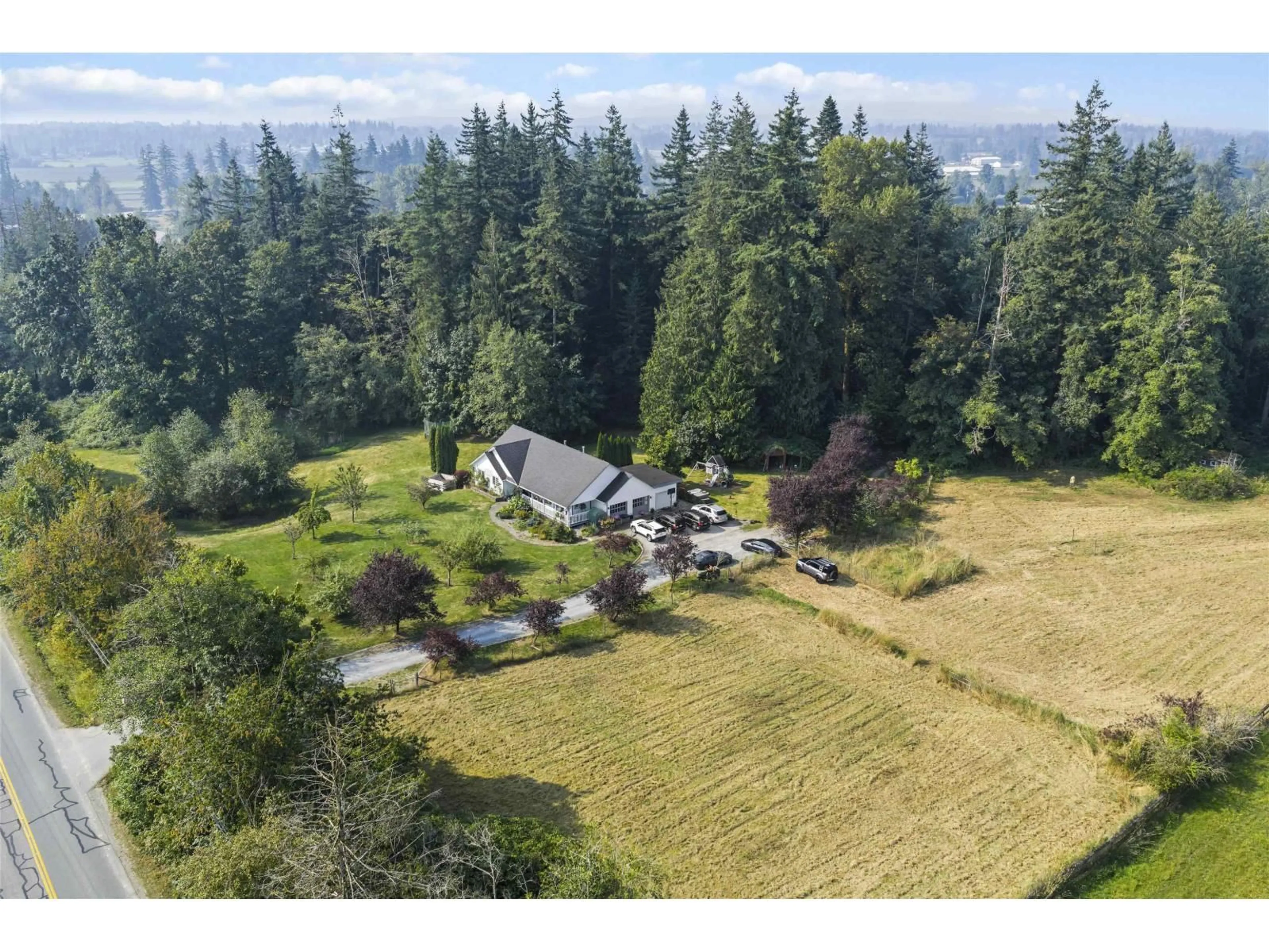 A pic from outside/outdoor area/front of a property/back of a property/a pic from drone, mountain view for 2567 232, Langley British Columbia V2Z3B5