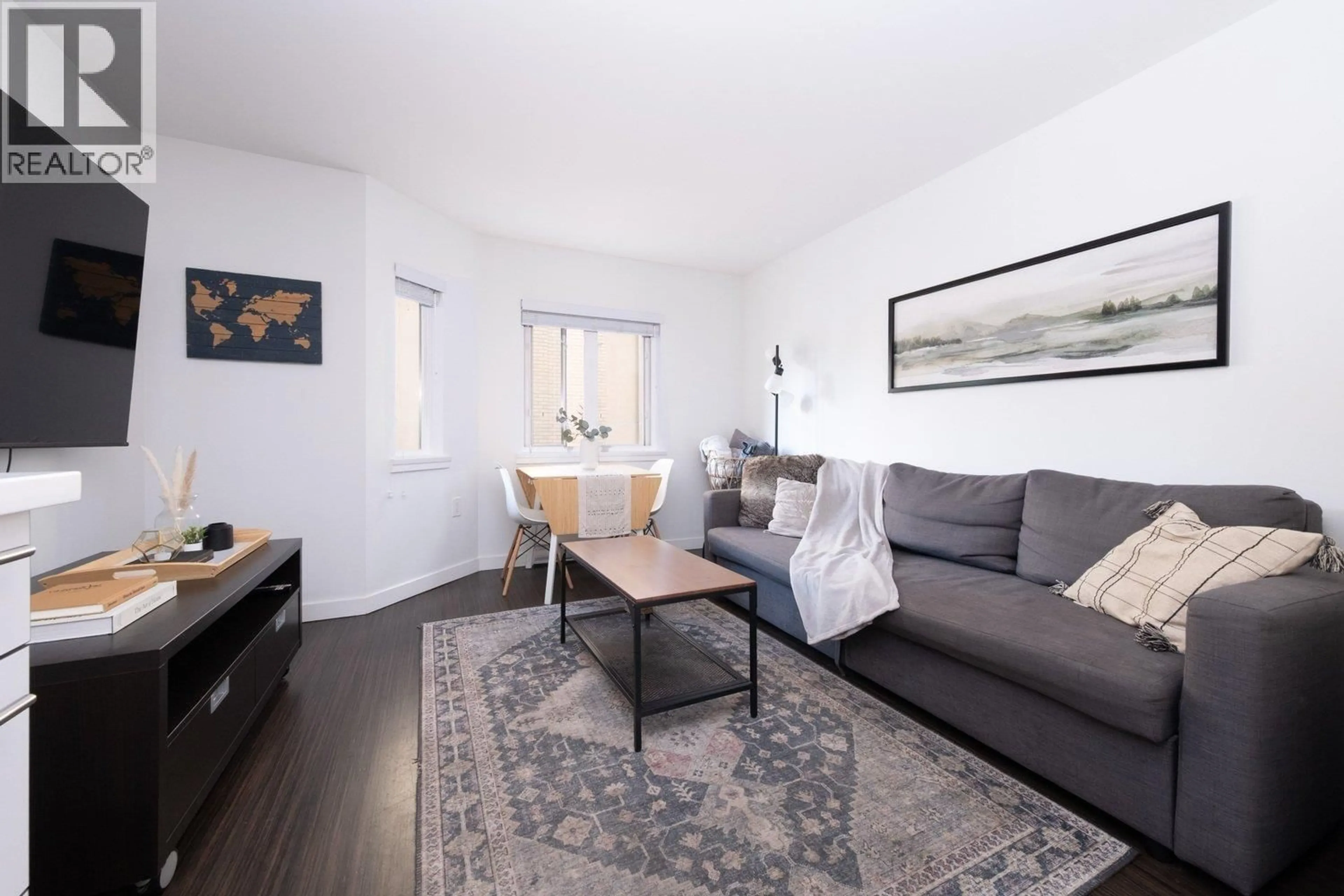 Living room with furniture, wood/laminate floor for 406 - 370 CARRALL STREET, Vancouver British Columbia V5B2J3