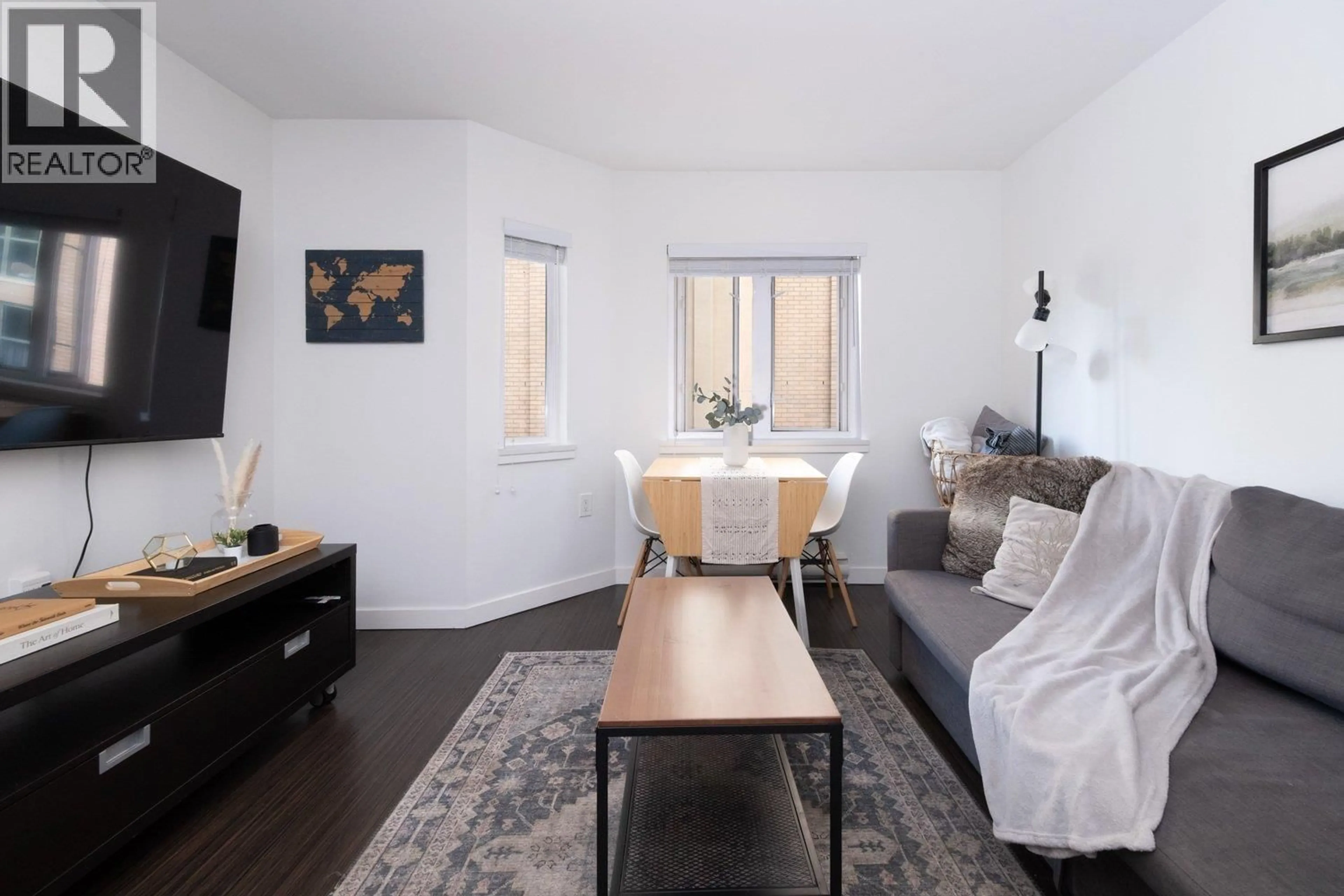 Living room with furniture, wood/laminate floor for 406 - 370 CARRALL STREET, Vancouver British Columbia V5B2J3