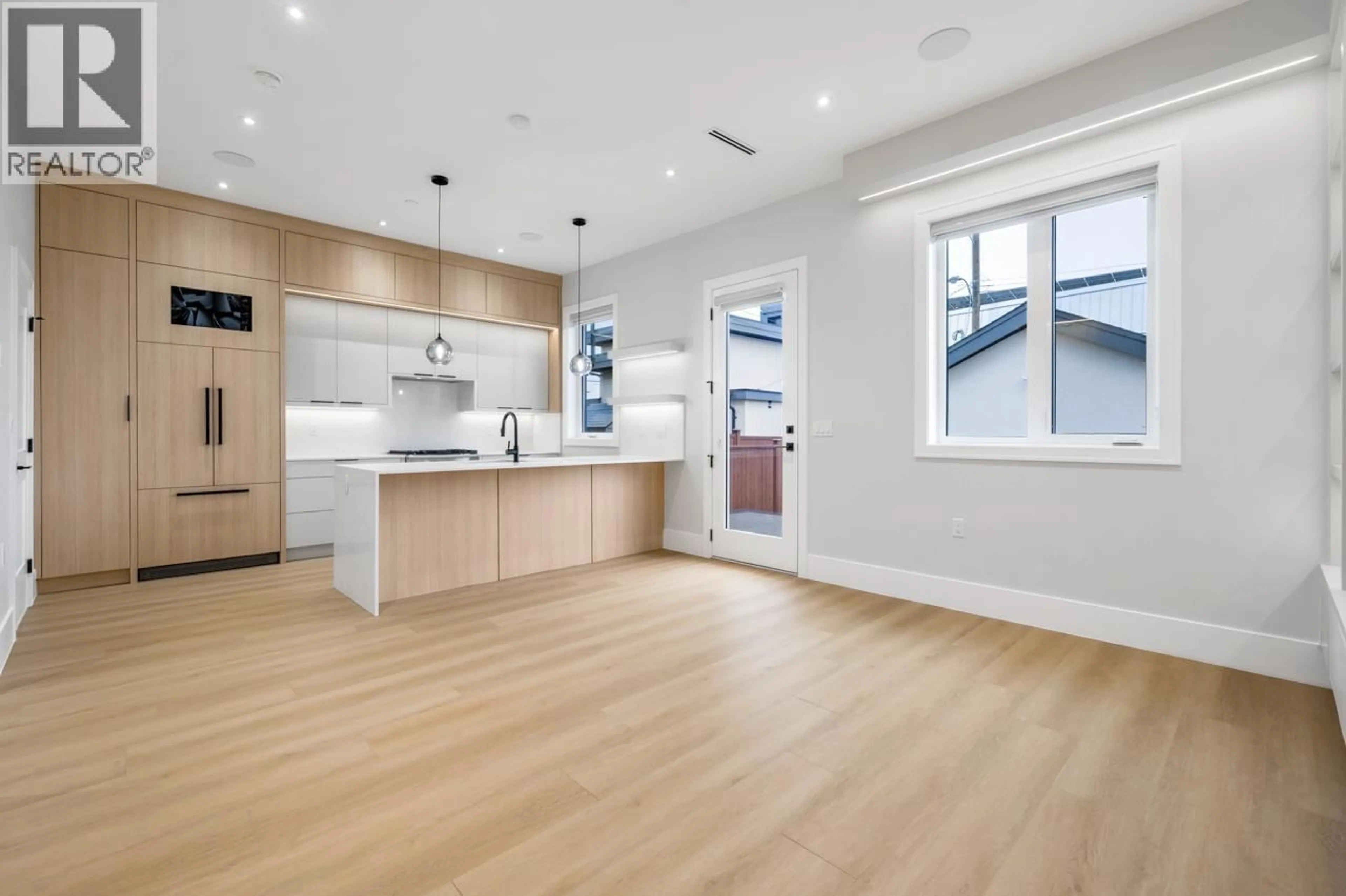 Open concept kitchen, wood/laminate floor for 2 - 1426 54TH AVENUE, Vancouver British Columbia V5P1Y1