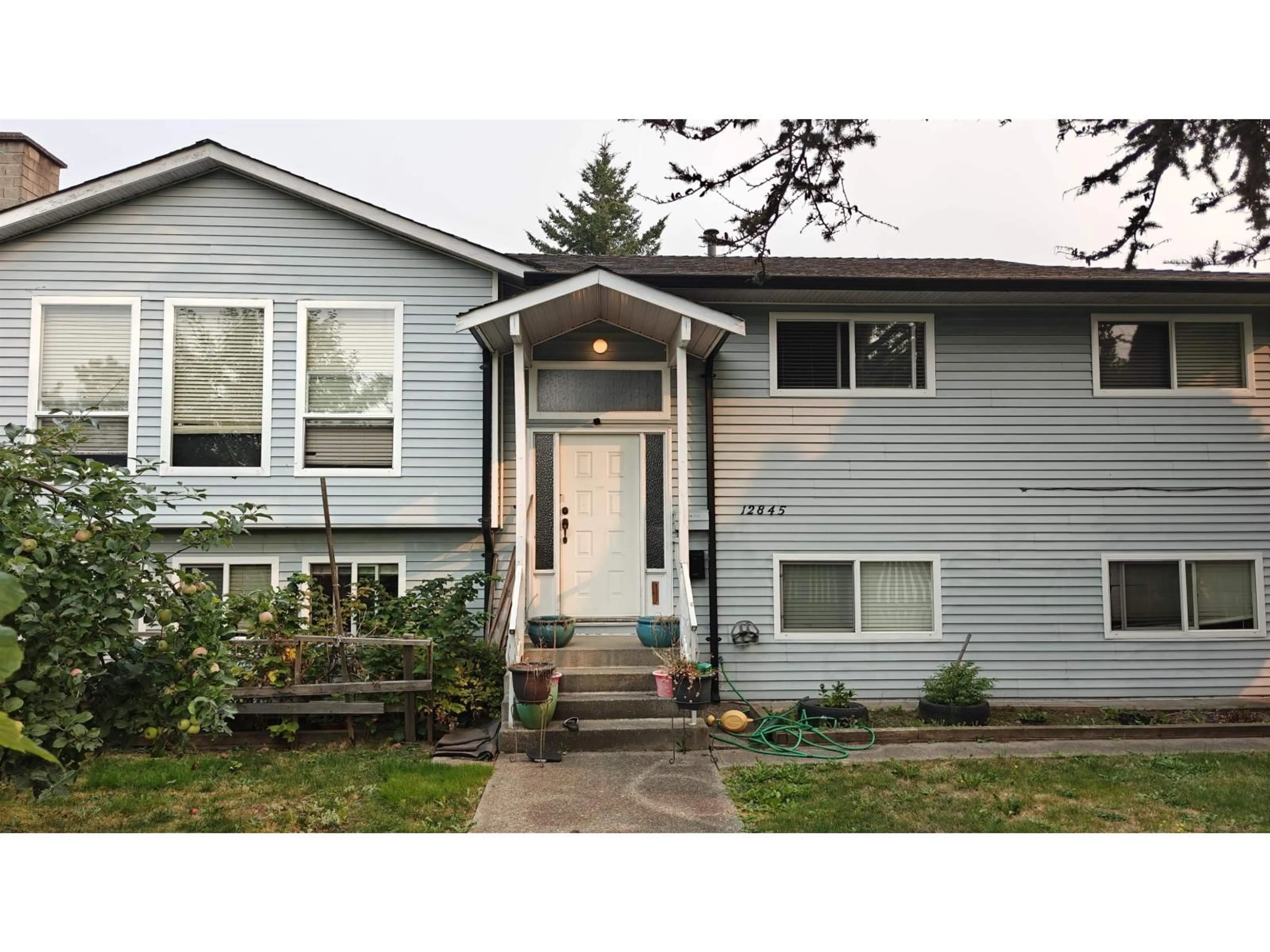 Home with vinyl exterior material, street for 12845 64, Surrey British Columbia V3W1X4