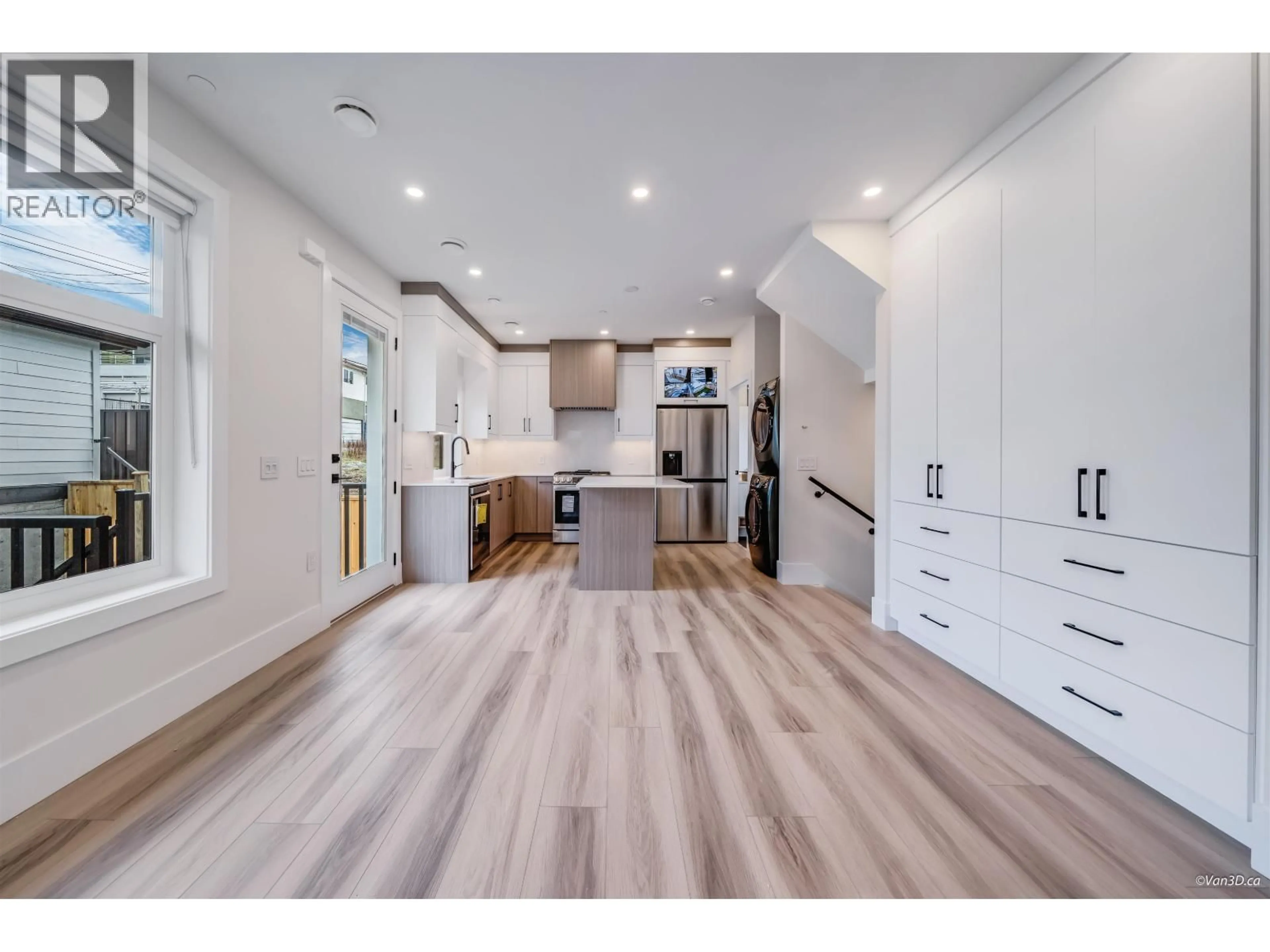 Open concept kitchen, wood/laminate floor for 4318 NANAIMO STREET, Vancouver British Columbia V5N5J1