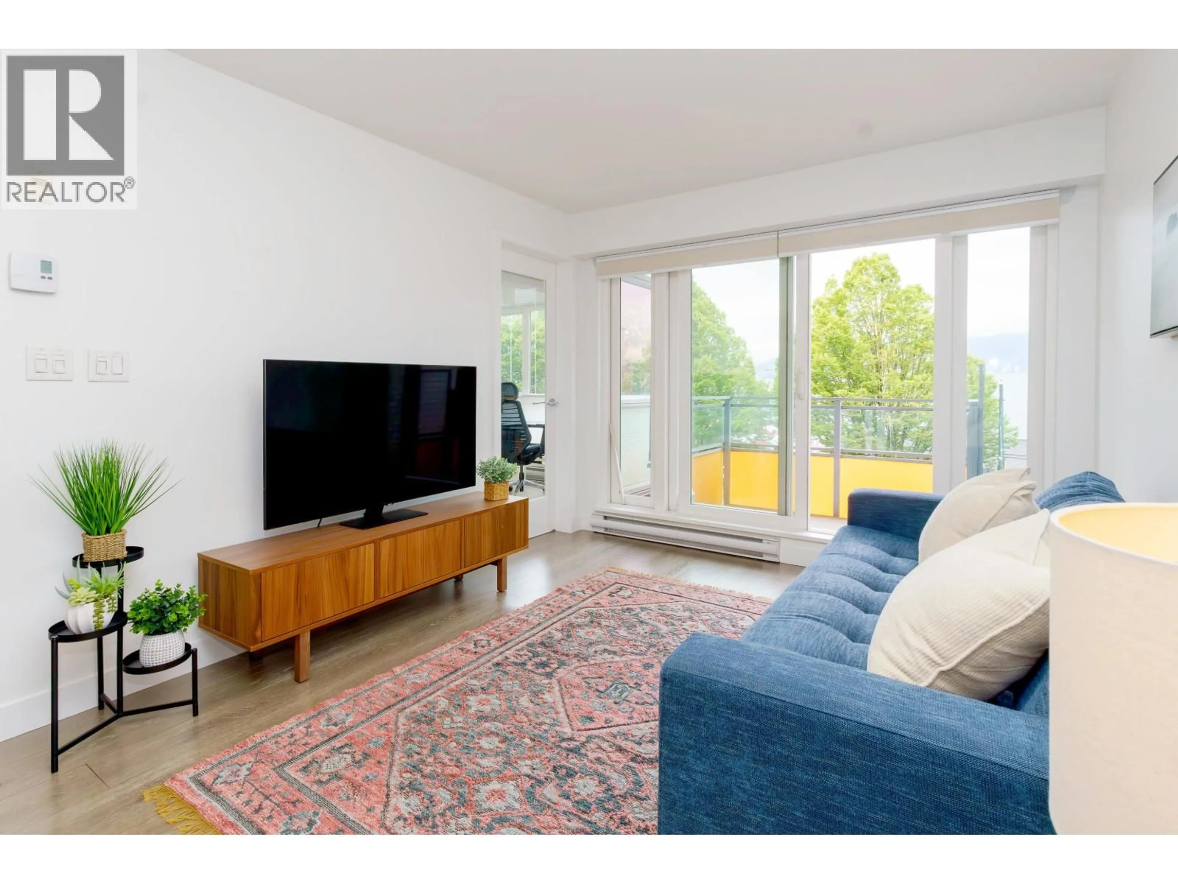 Living room with furniture, wood/laminate floor for 1588 HASTINGS STREET, Vancouver British Columbia V5L0B8