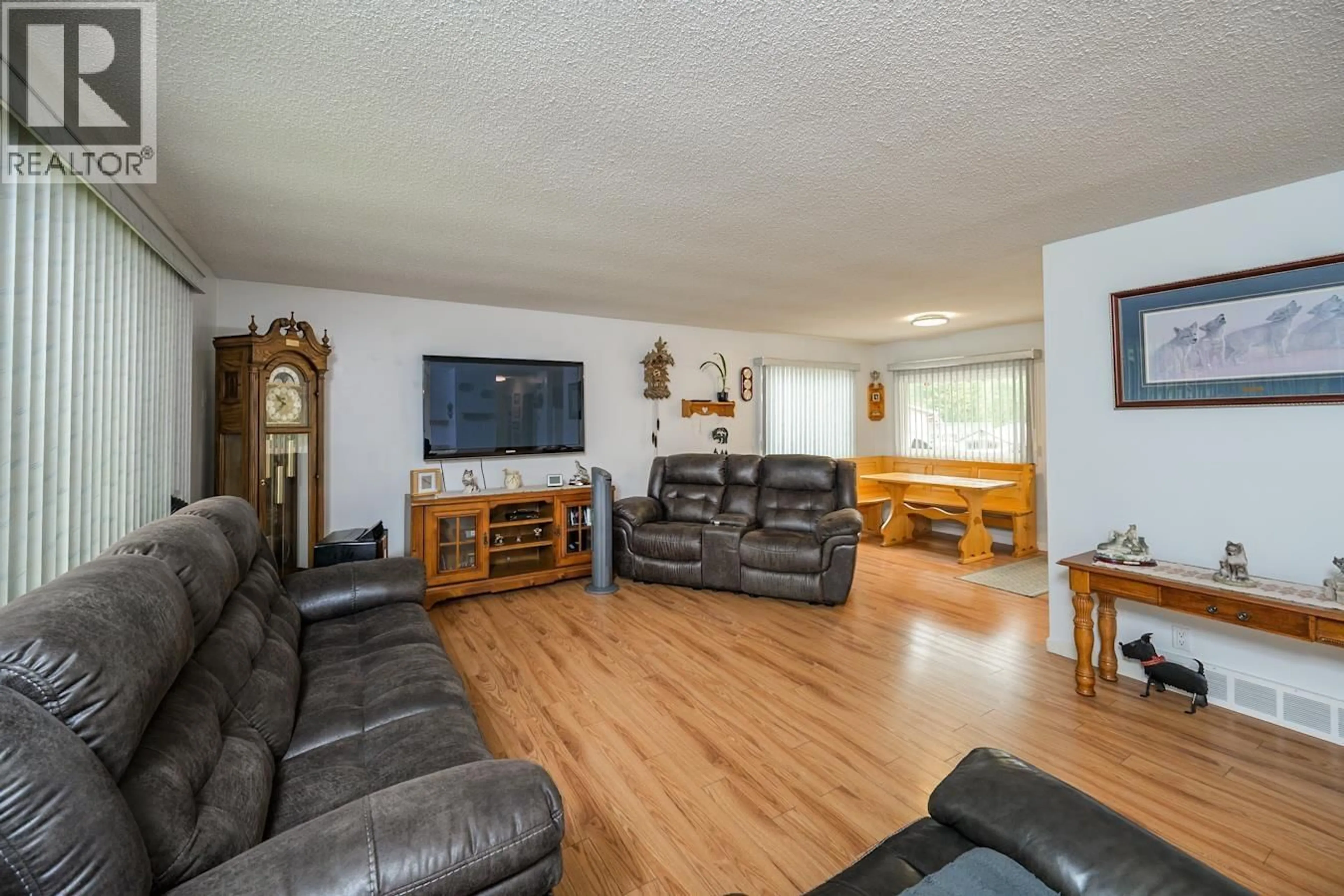 Living room with furniture, wood/laminate floor for 7170 GUELPH PLACE, Prince George British Columbia V2N4A2