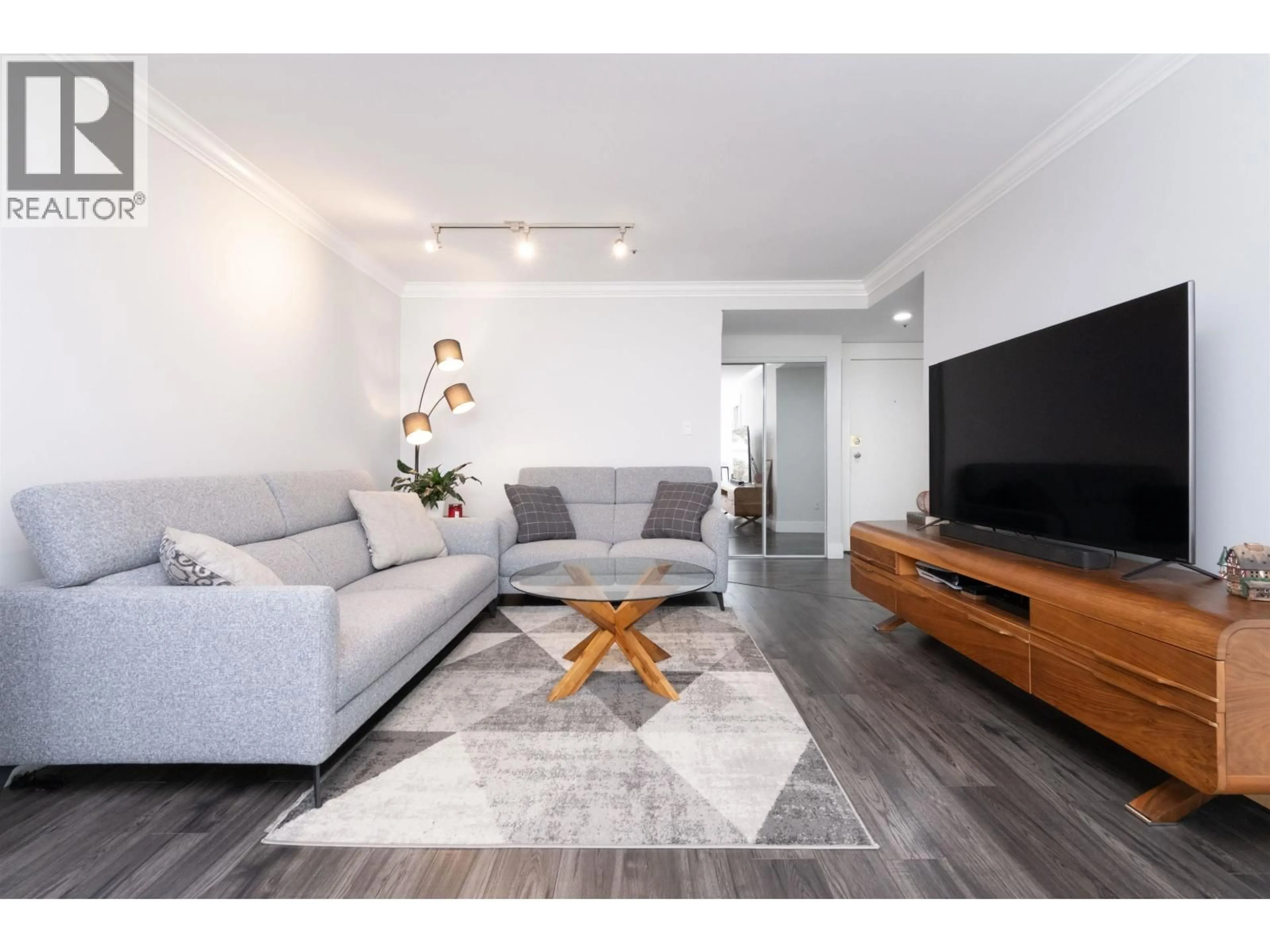 Living room with furniture, wood/laminate floor for 304 - 7700 GILBERT ROAD, Richmond British Columbia V7C3W2