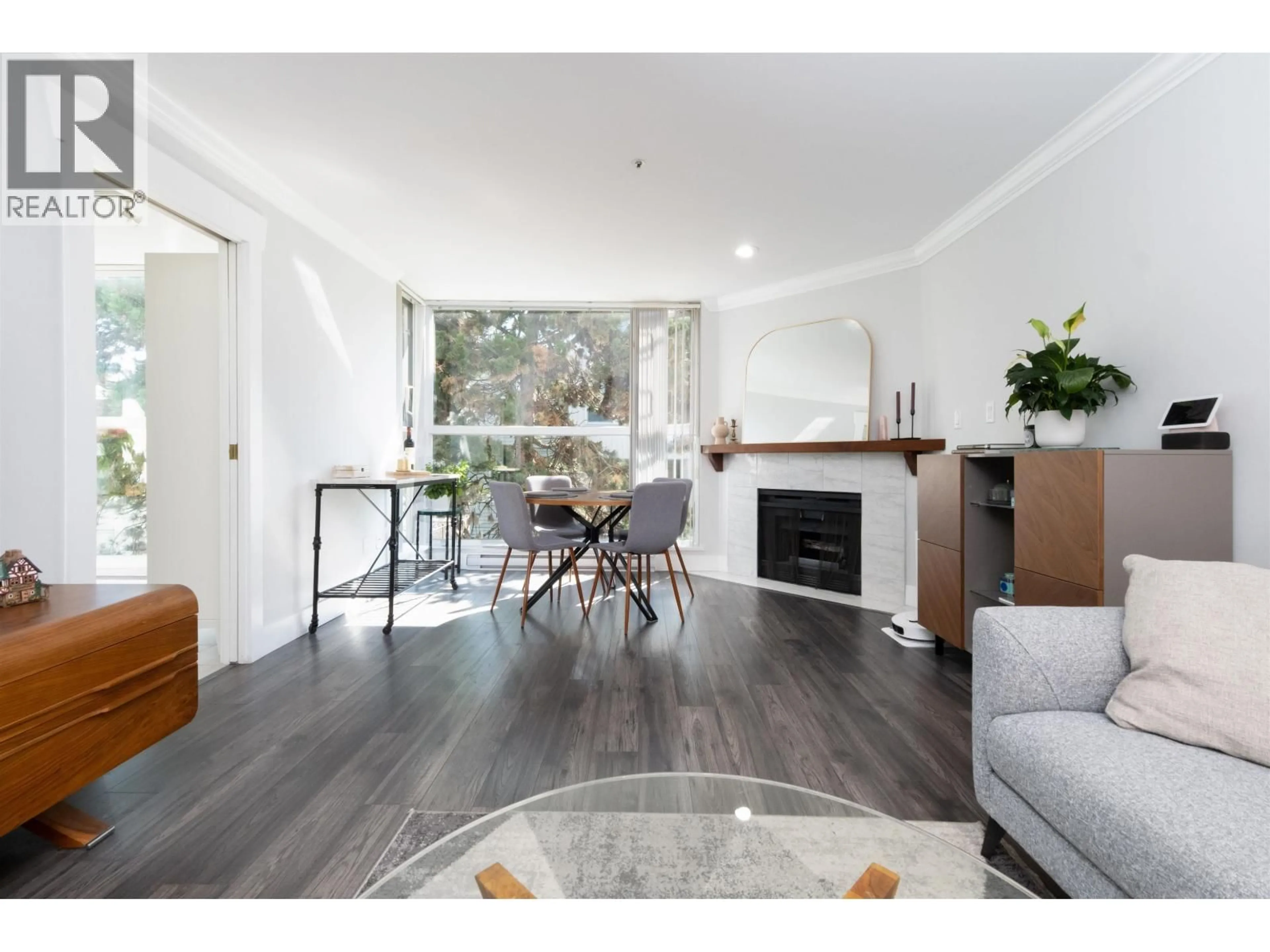 Living room with furniture, wood/laminate floor for 304 - 7700 GILBERT ROAD, Richmond British Columbia V7C3W2