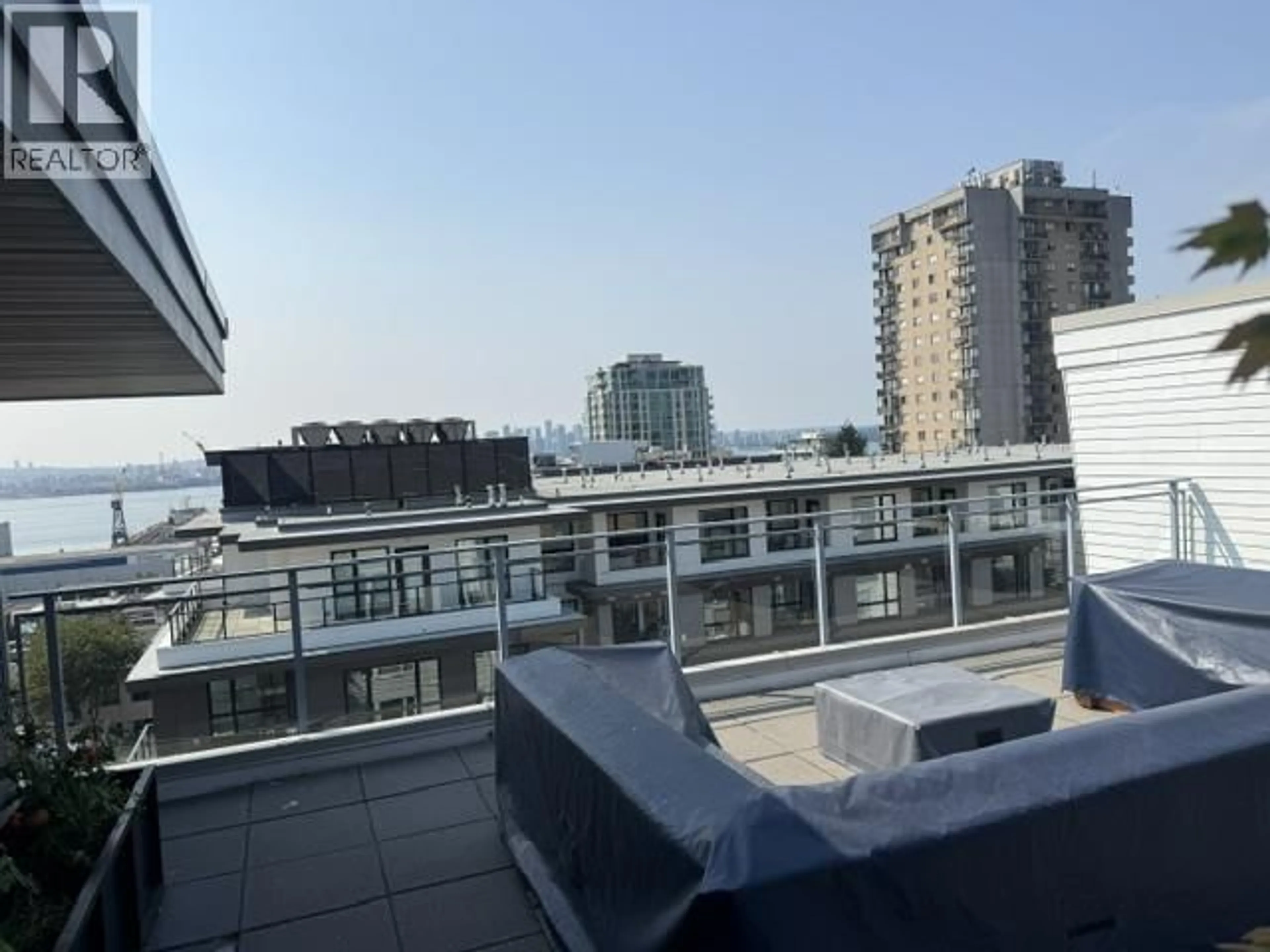 Balcony in the apartment, city buildings view from balcony for 111 - 221 3RD STREET, North Vancouver British Columbia V7L0C1