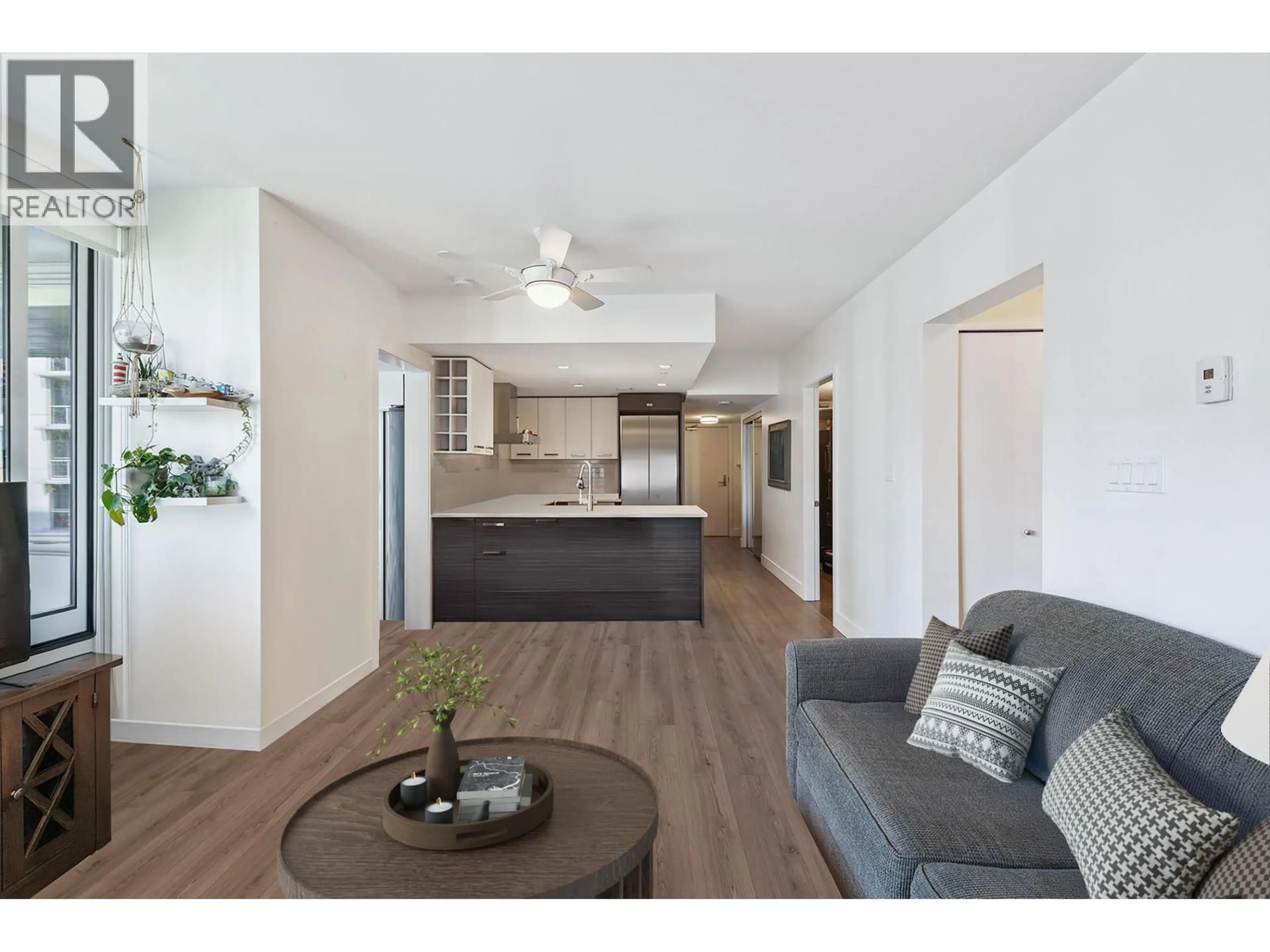 Open concept kitchen, wood/laminate floor for 621 - 1783 MANITOBA STREET, Vancouver British Columbia V5Y0K1
