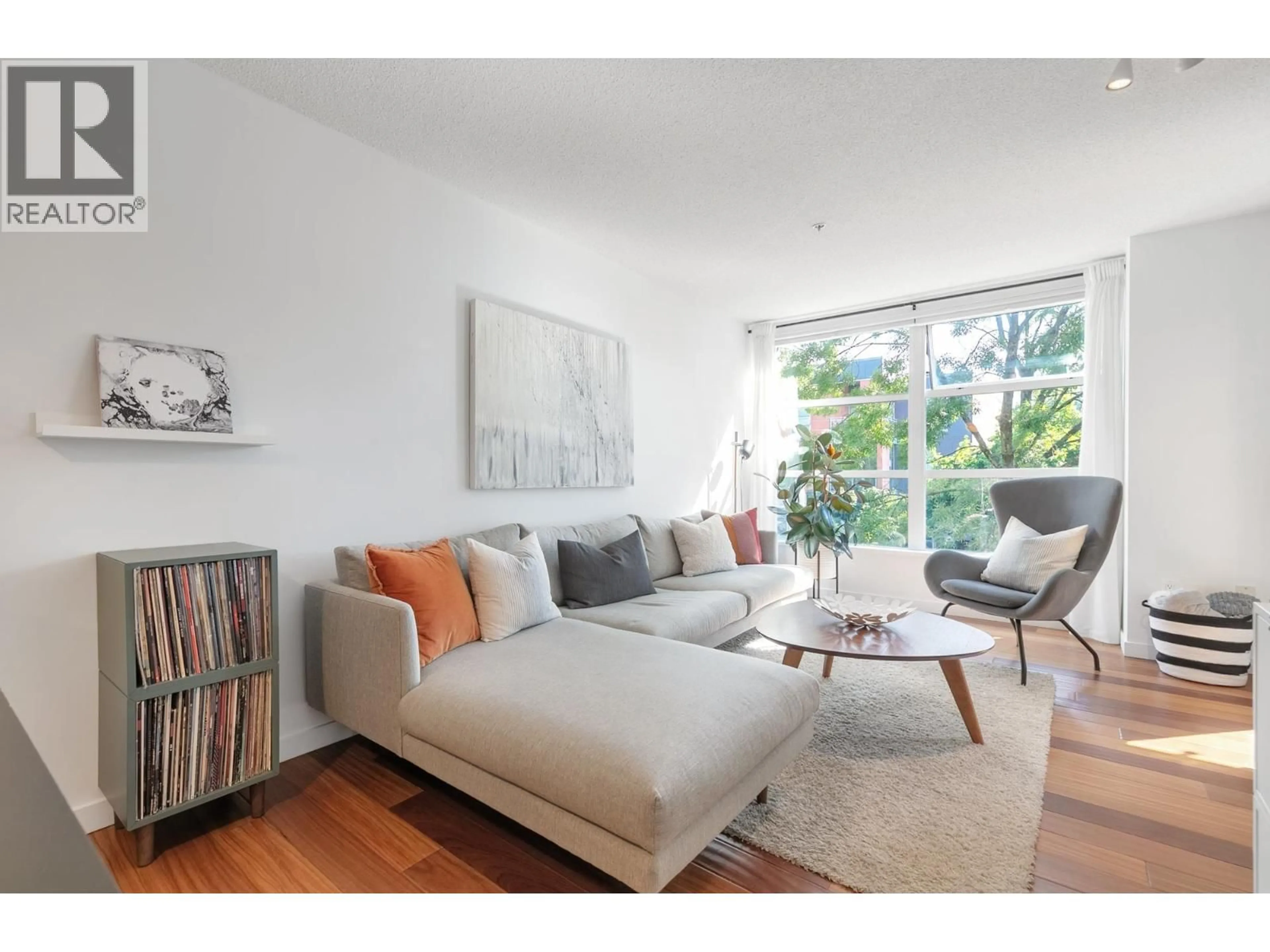 Living room with furniture, wood/laminate floor for 219 - 2768 CRANBERRY DRIVE, Vancouver British Columbia V6K4V1