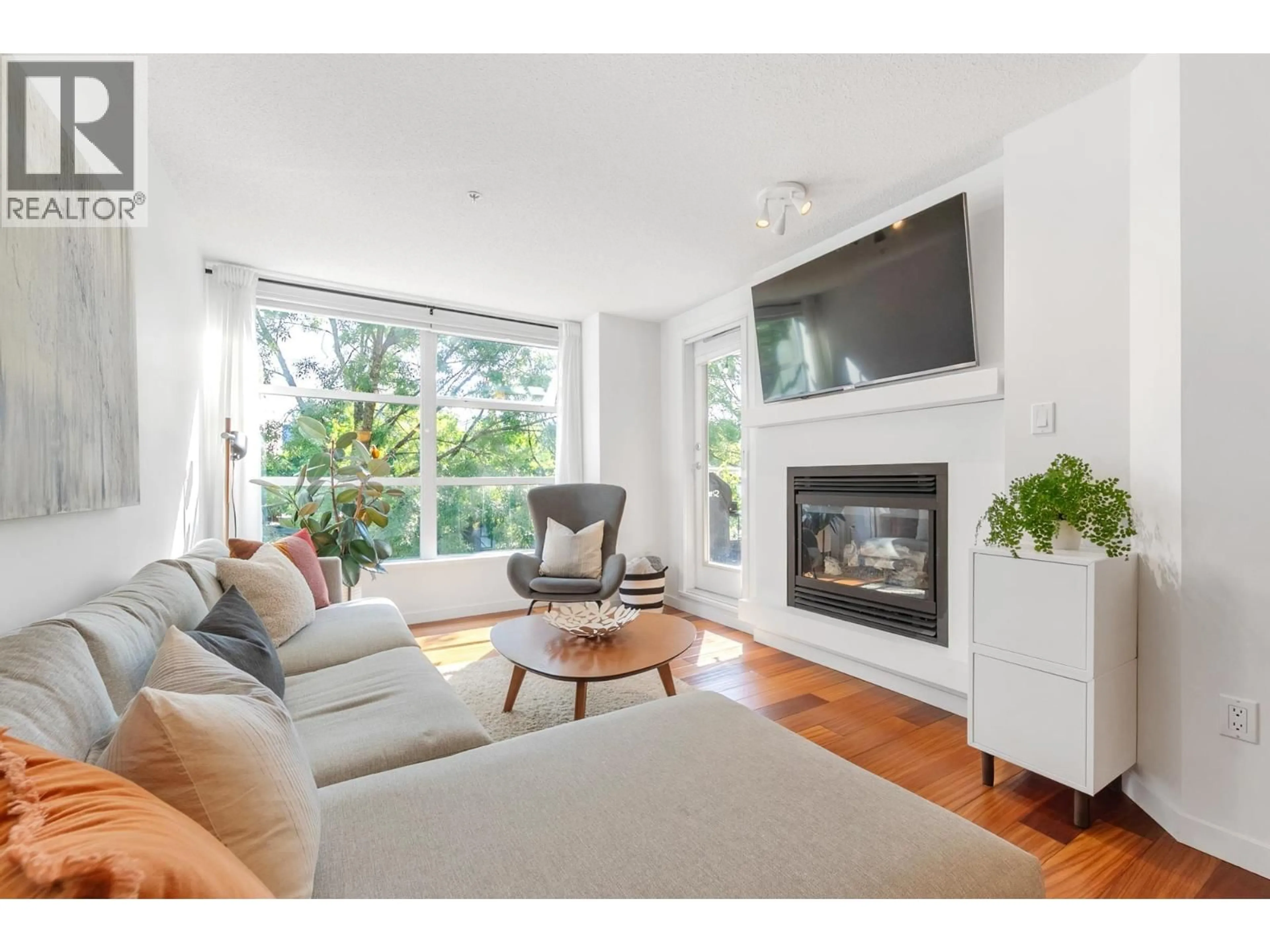 Living room with furniture, wood/laminate floor for 219 - 2768 CRANBERRY DRIVE, Vancouver British Columbia V6K4V1