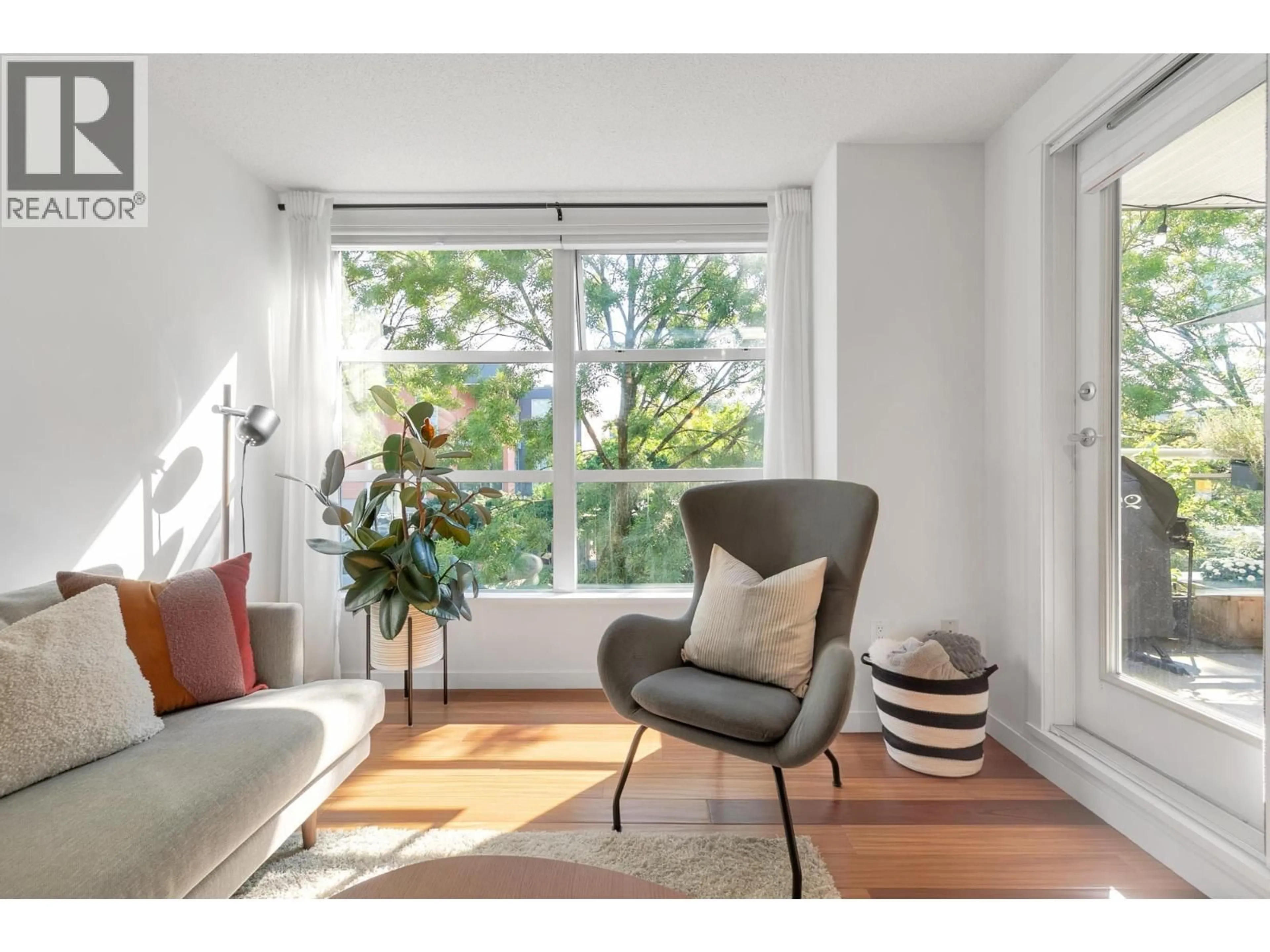 Living room with furniture, wood/laminate floor for 219 - 2768 CRANBERRY DRIVE, Vancouver British Columbia V6K4V1