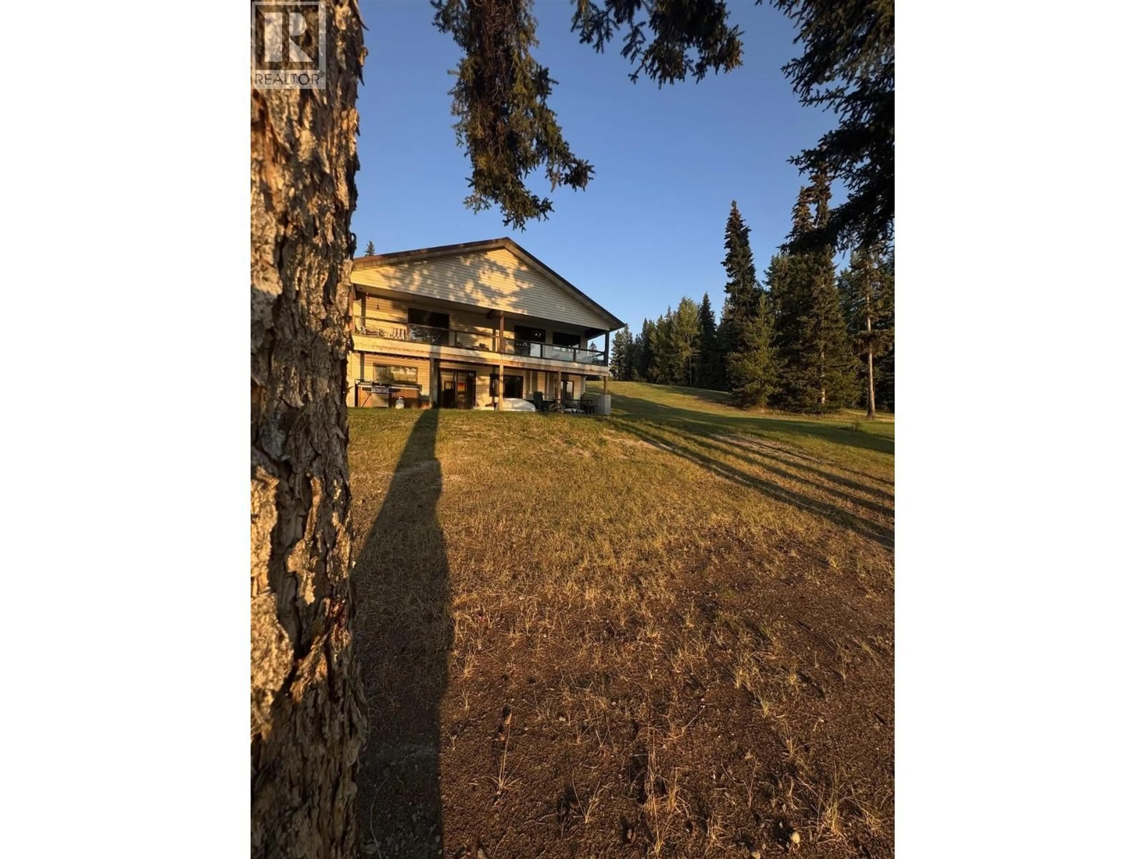 A pic from outside/outdoor area/front of a property/back of a property/a pic from drone, forest/trees view for 624 TIBBLES ROAD, Quesnel British Columbia V2J3H9