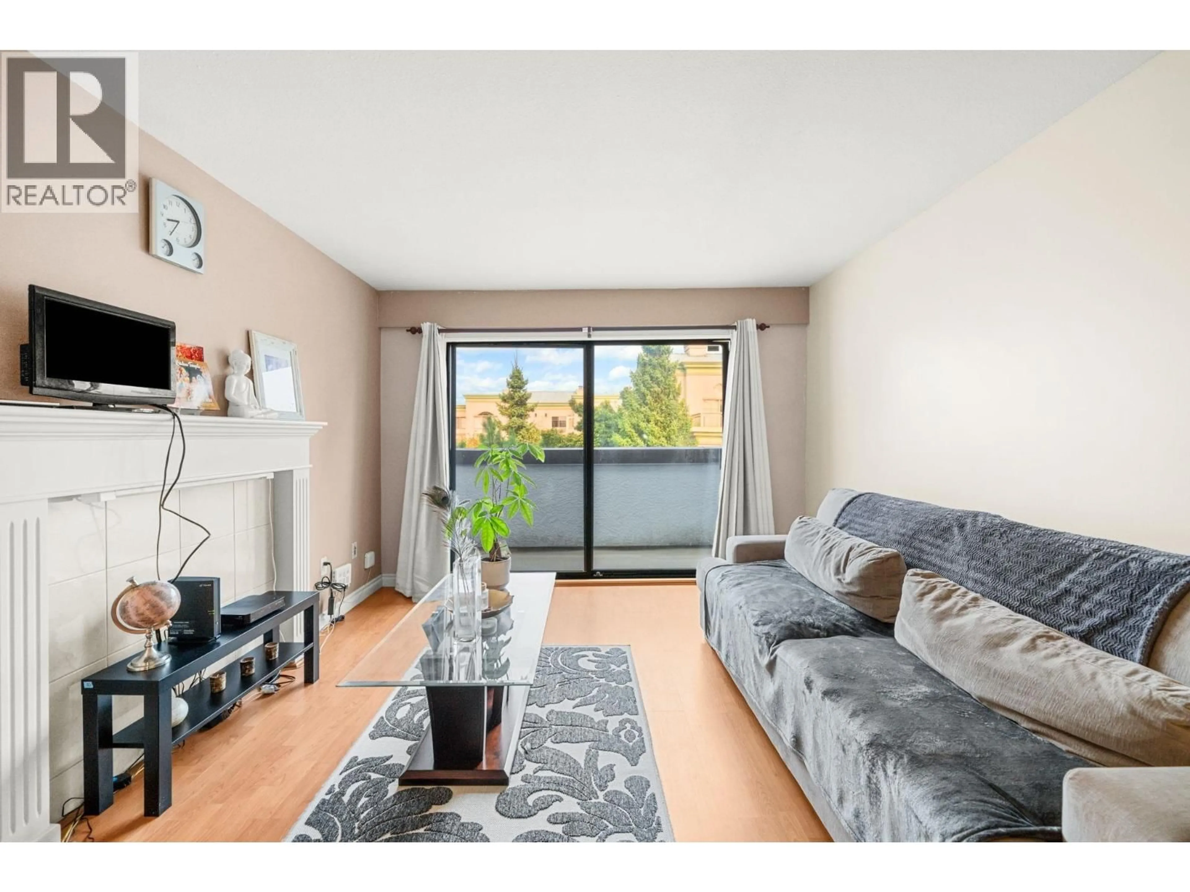 Living room with furniture, wood/laminate floor for 330 - 7480 ST. ALBANS ROAD, Richmond British Columbia V6Y2K6
