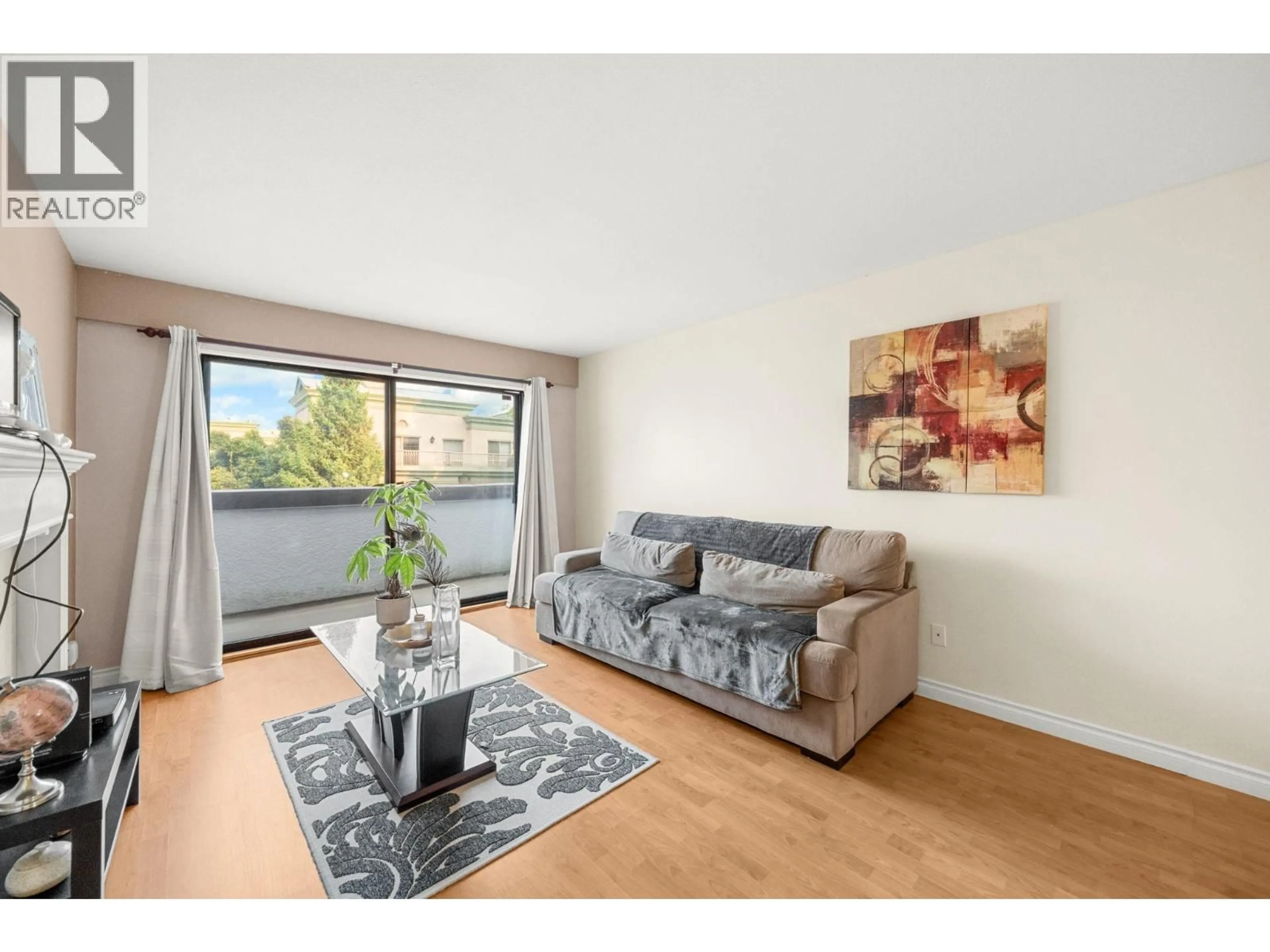 Living room with furniture, wood/laminate floor for 330 - 7480 ST. ALBANS ROAD, Richmond British Columbia V6Y2K6