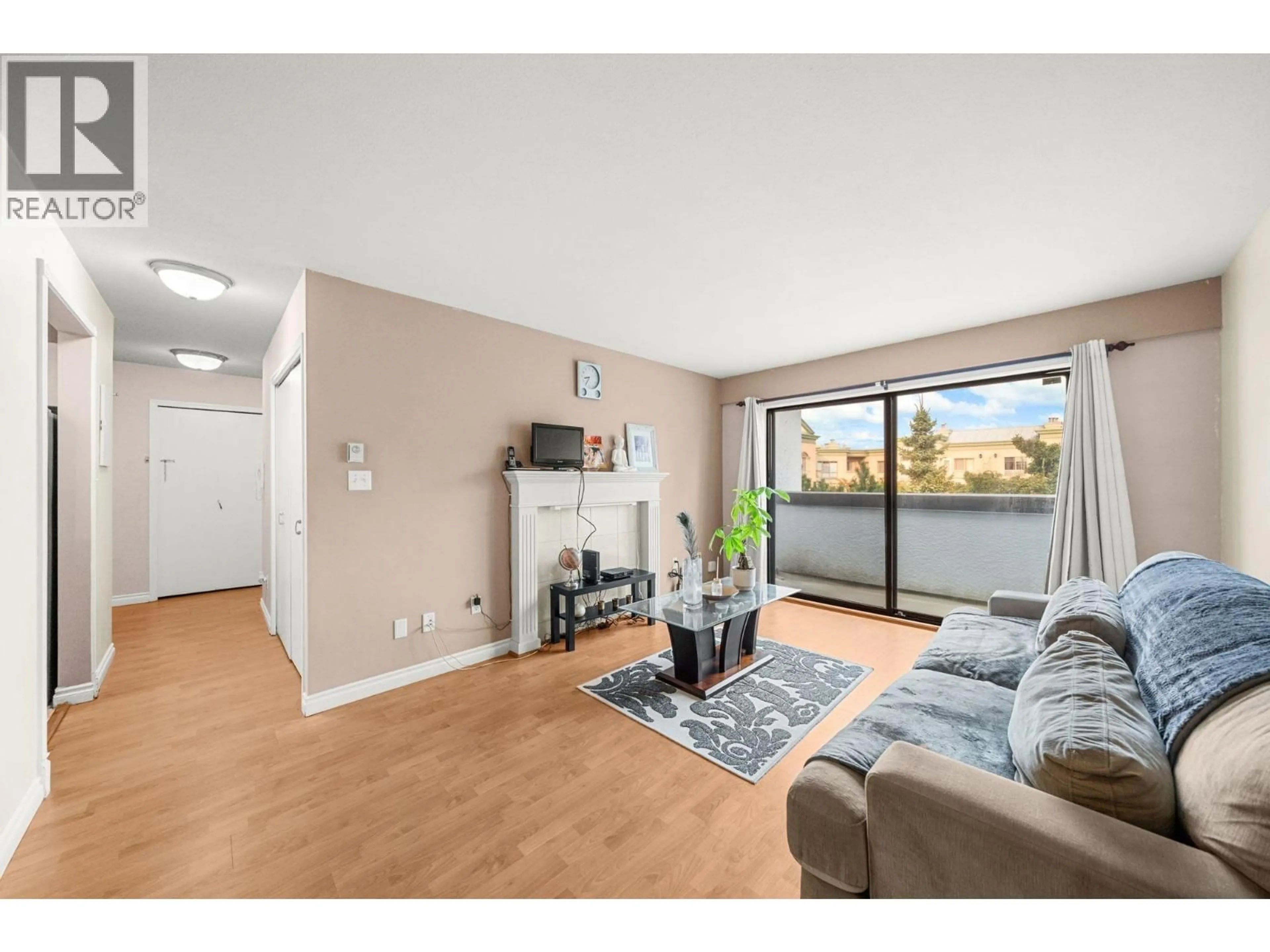 Living room with furniture, wood/laminate floor for 330 - 7480 ST. ALBANS ROAD, Richmond British Columbia V6Y2K6