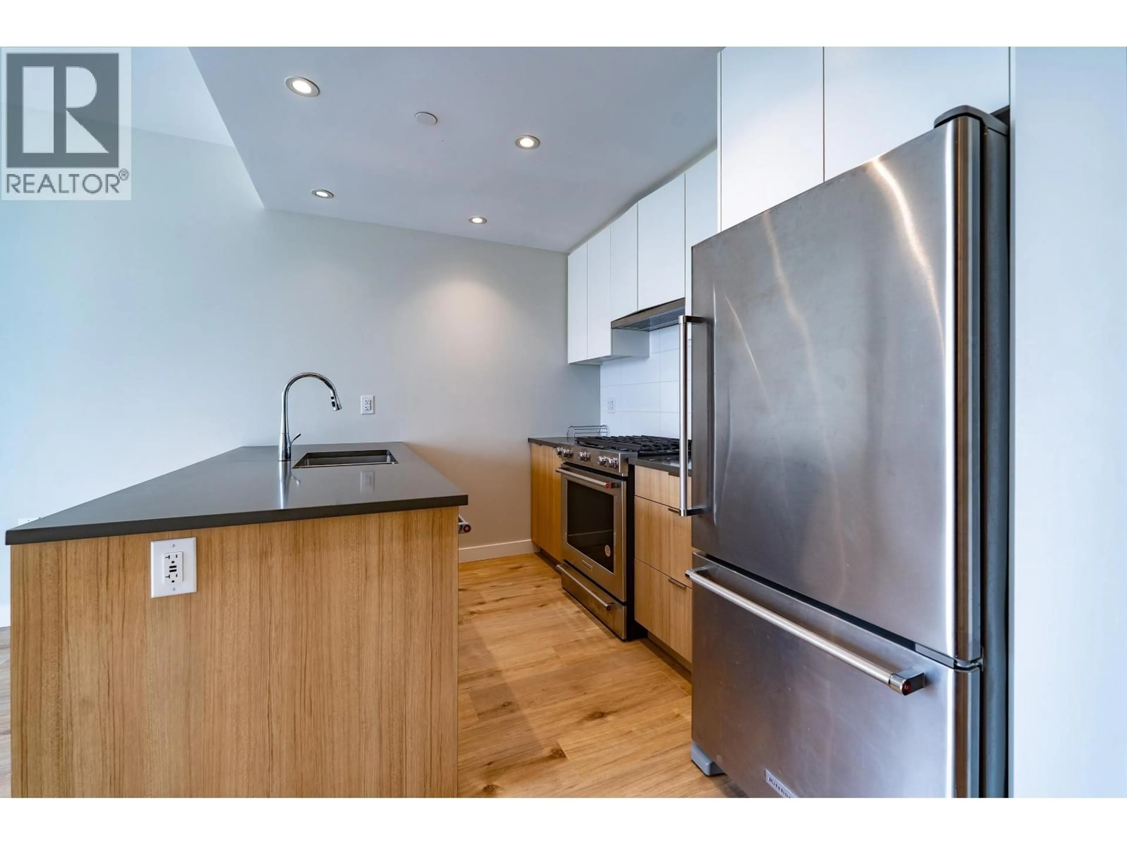 Standard kitchen, wood/laminate floor for 324 - 3430 KENT AVENUE, Vancouver British Columbia V5S0G7