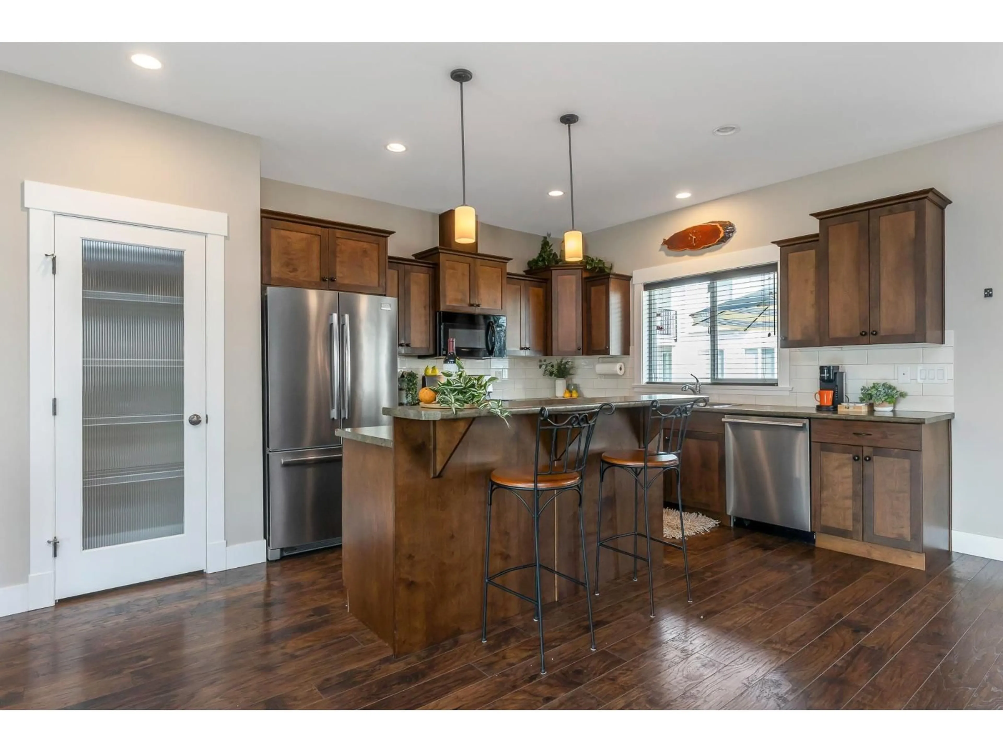 Open concept kitchen, wood/laminate floor for 7148 ROCHESTER AVENUE, Chilliwack British Columbia V2R2P3