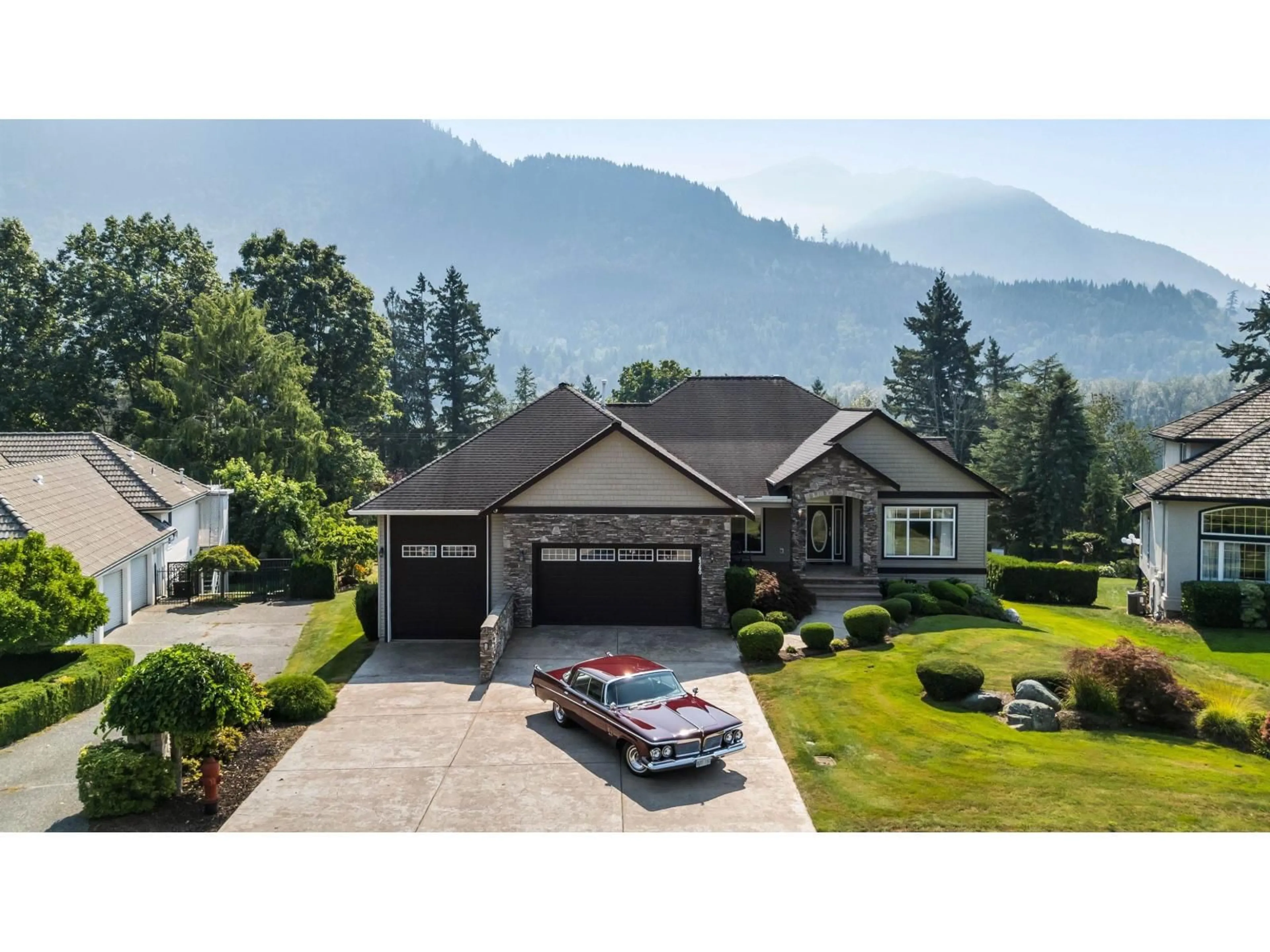 A pic from outside/outdoor area/front of a property/back of a property/a pic from drone, mountain view for 4360 ESTATE DRIVE, Chilliwack British Columbia V2R3B4