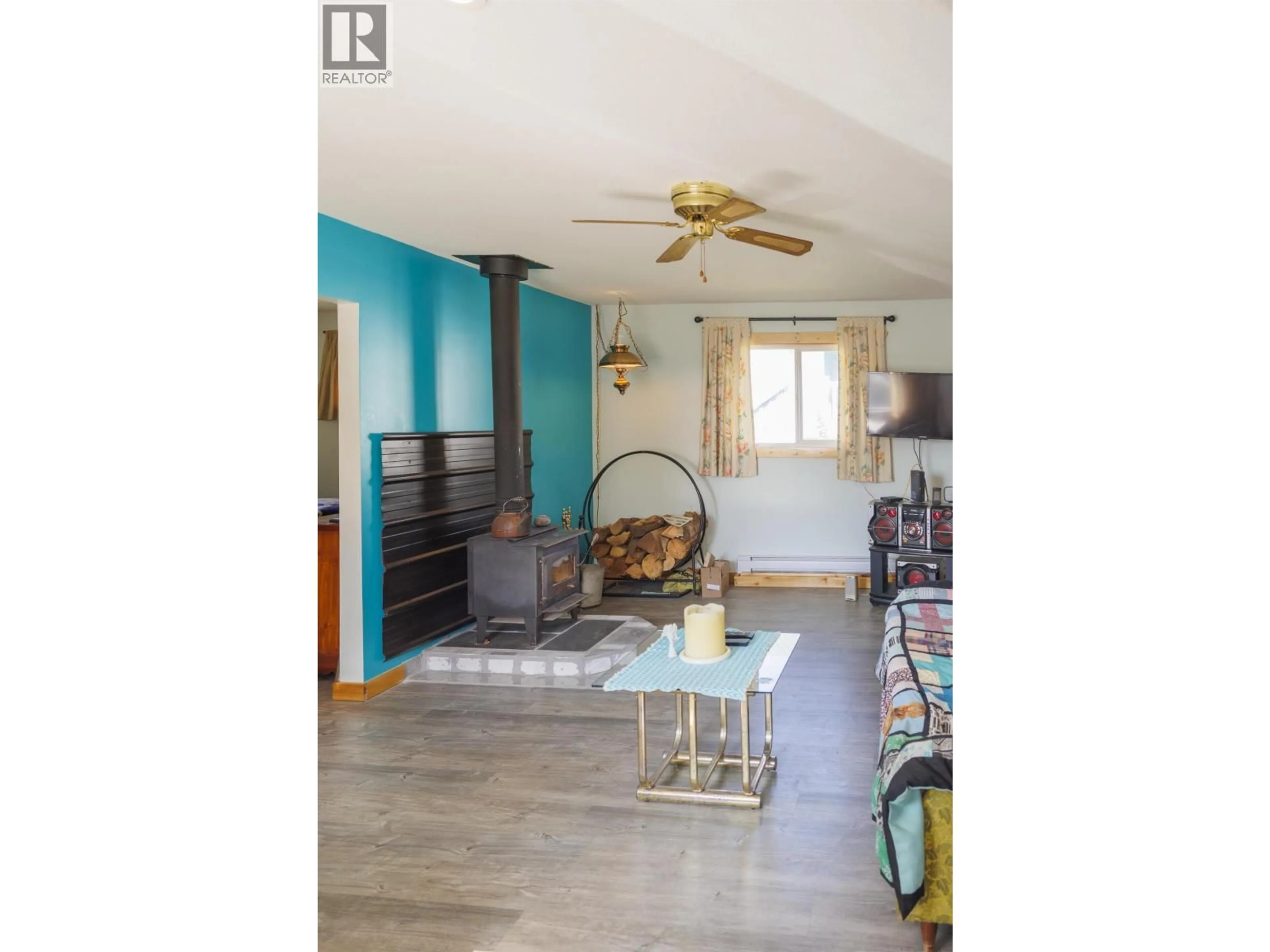 Living room with furniture, wood/laminate floor for 861 2ND AVENUE, McBride British Columbia V0J2E0