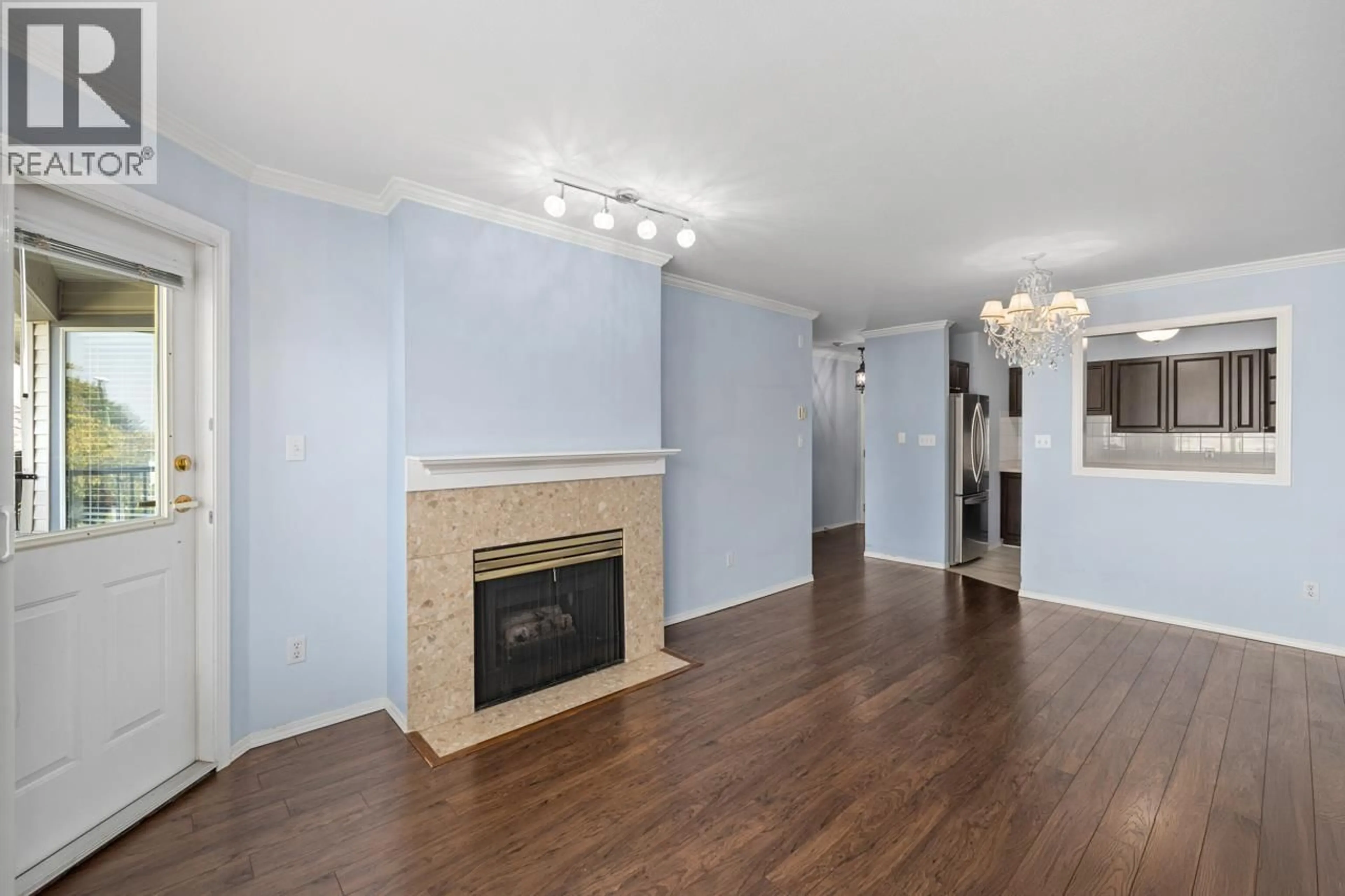 Living room with furniture, wood/laminate floor for 216 - 5875 IMPERIAL STREET, Burnaby British Columbia V5J1G4