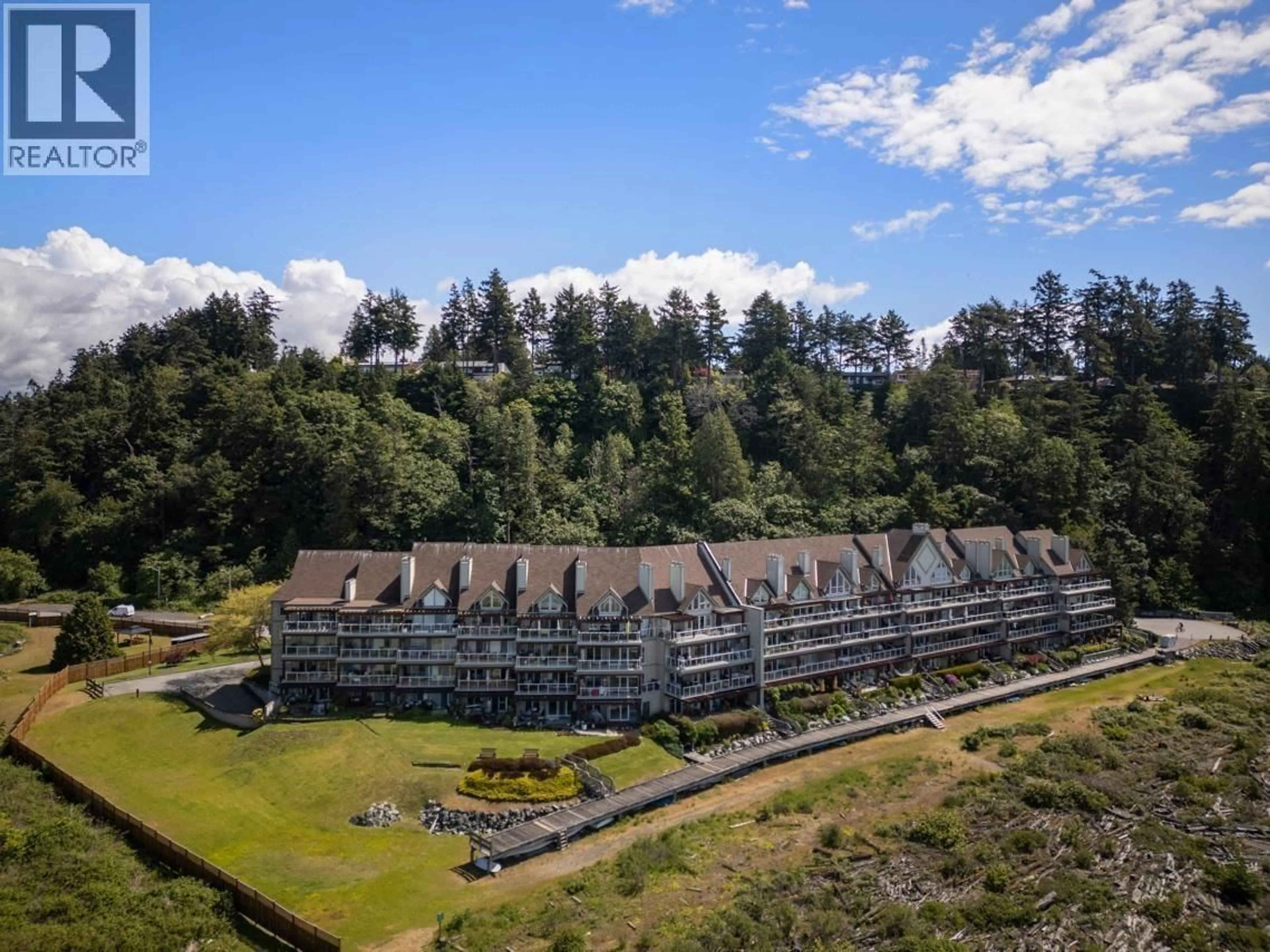 A pic from outside/outdoor area/front of a property/back of a property/a pic from drone, mountain view for 319 - 1120 TSATSU SHORES DRIVE, Delta British Columbia V4M4G3