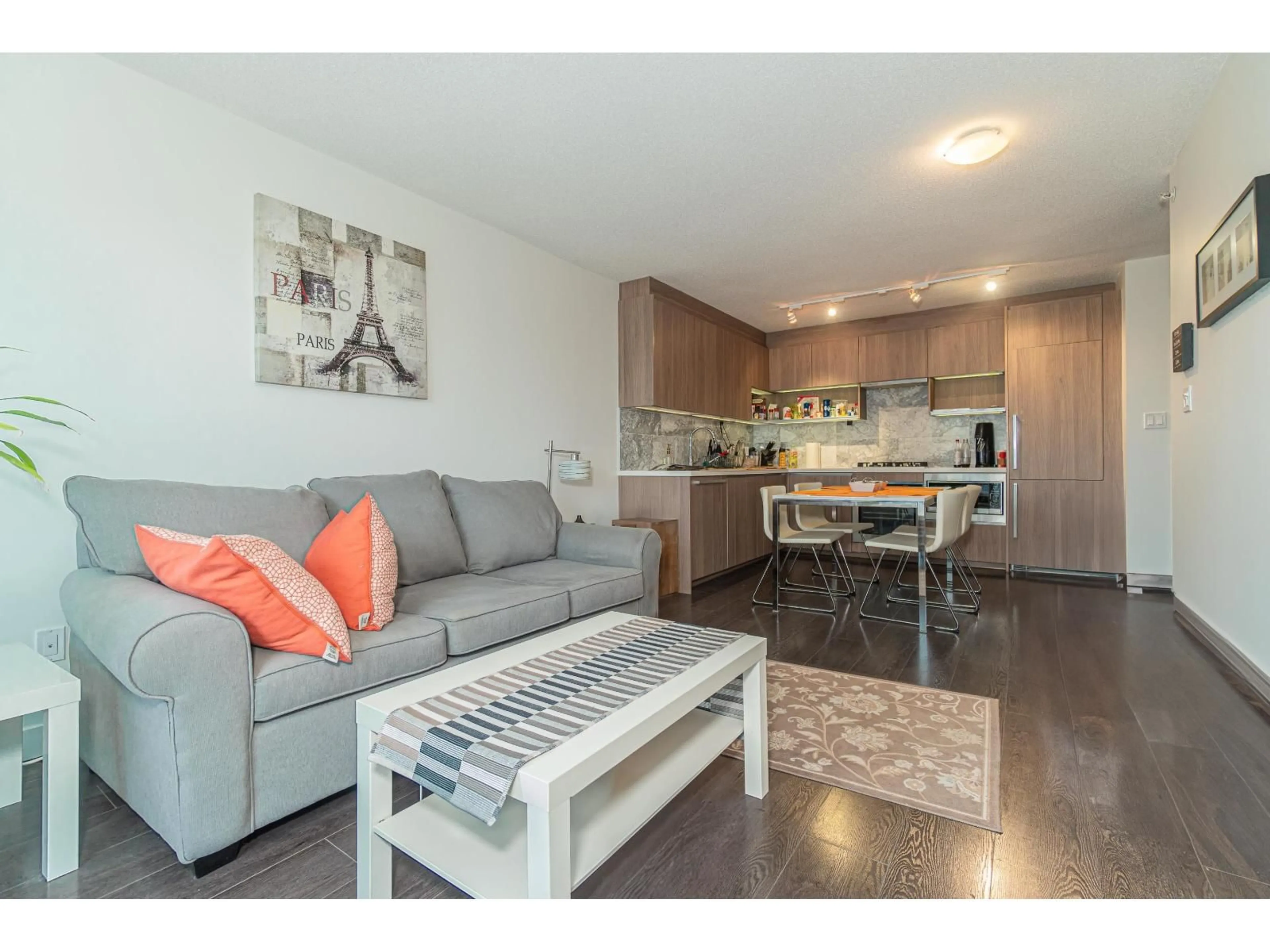 Living room with furniture, wood/laminate floor for 1915 - 13750 100, Surrey British Columbia V3T0L3