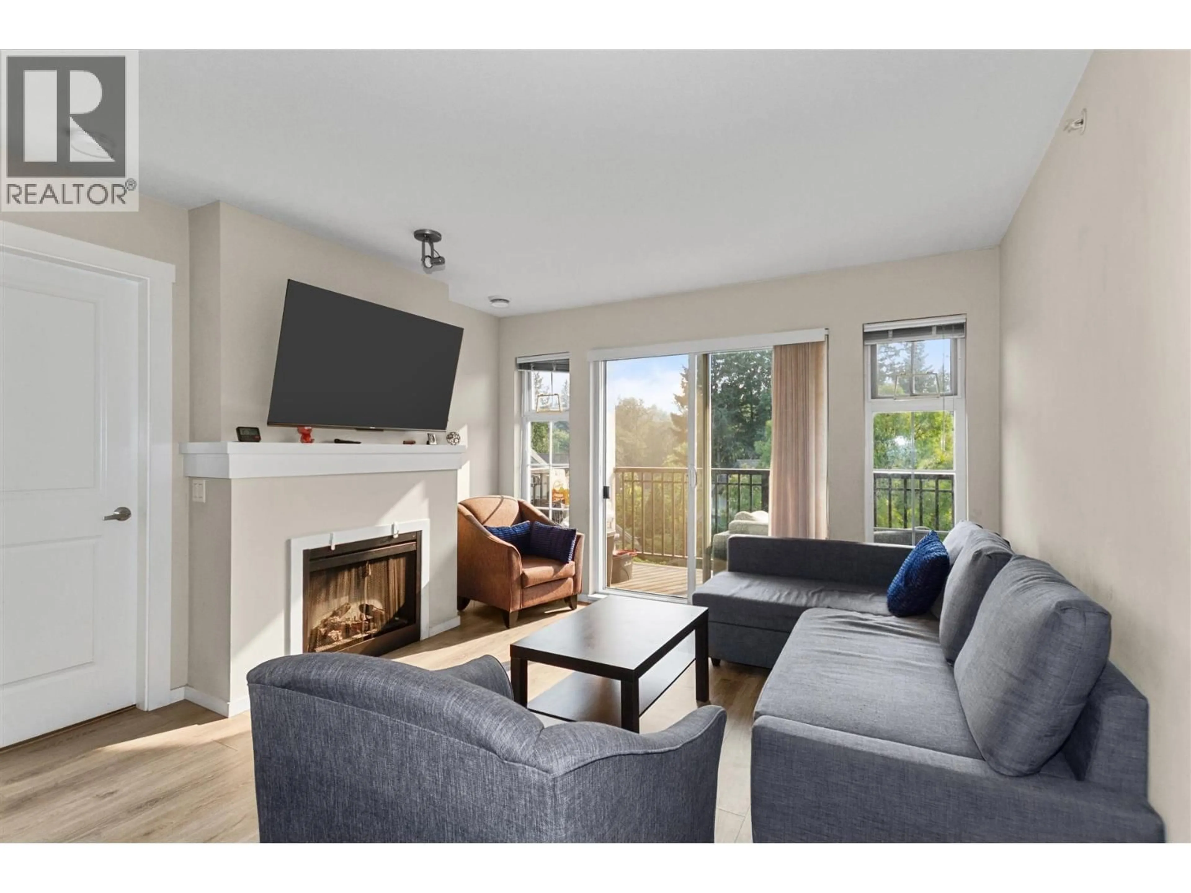 Living room with furniture, wood/laminate floor for 410 - 9233 GOVERNMENT STREET, Burnaby British Columbia V3N0A3
