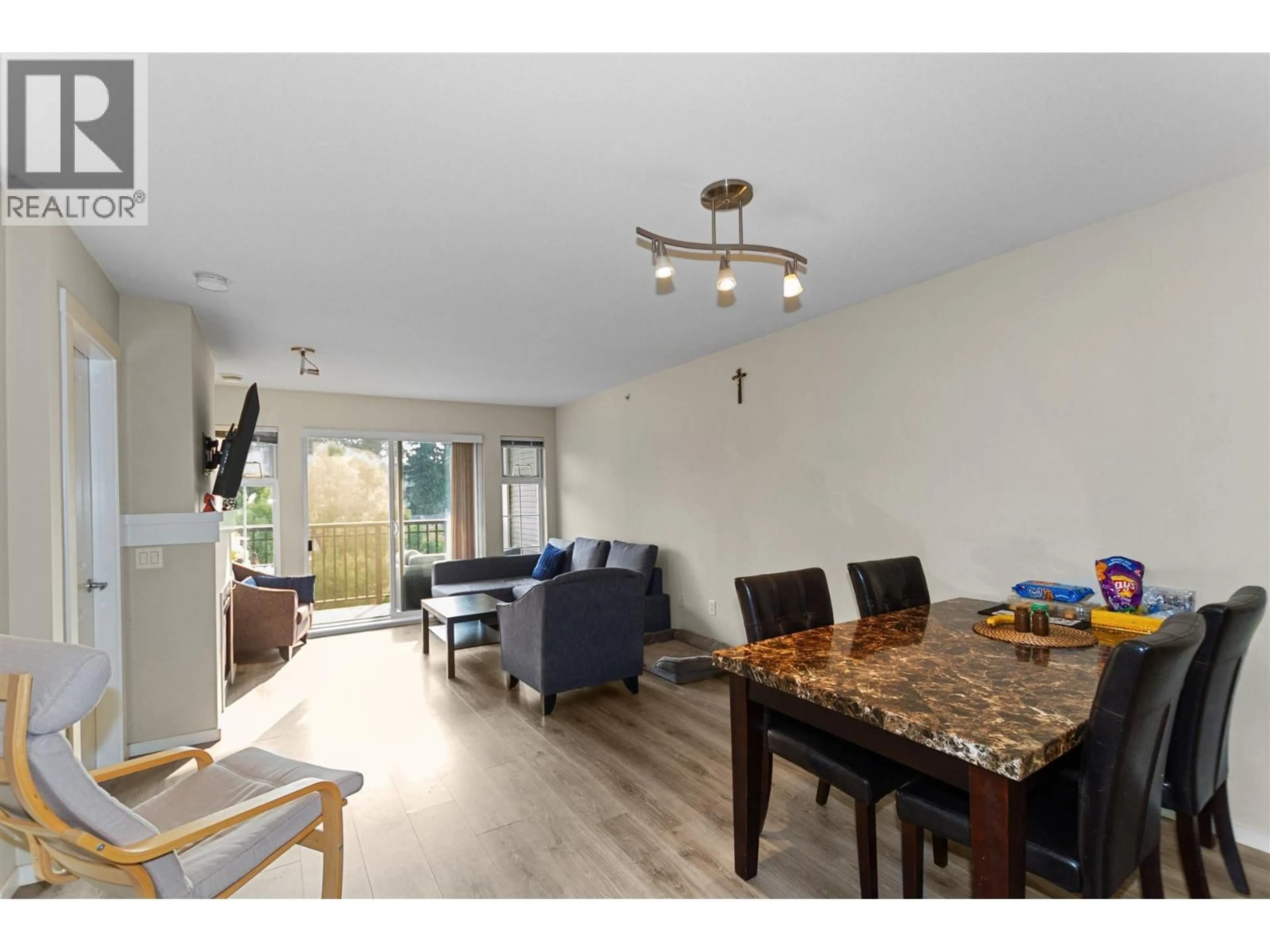 Living room with furniture, wood/laminate floor for 410 - 9233 GOVERNMENT STREET, Burnaby British Columbia V3N0A3