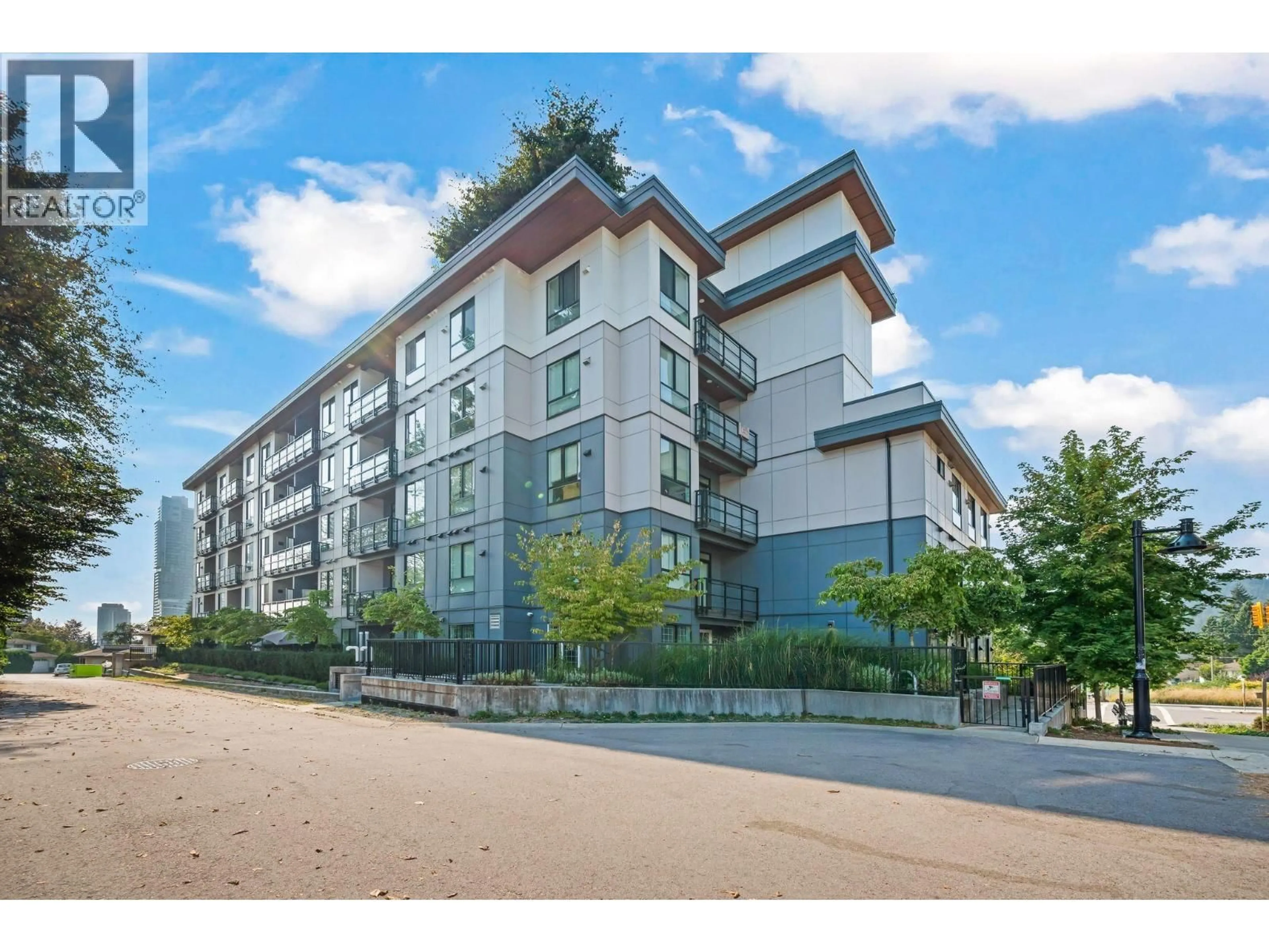 A pic from outside/outdoor area/front of a property/back of a property/a pic from drone, unknown for 102 - 700 CLARKE ROAD, Coquitlam British Columbia V3J0K5