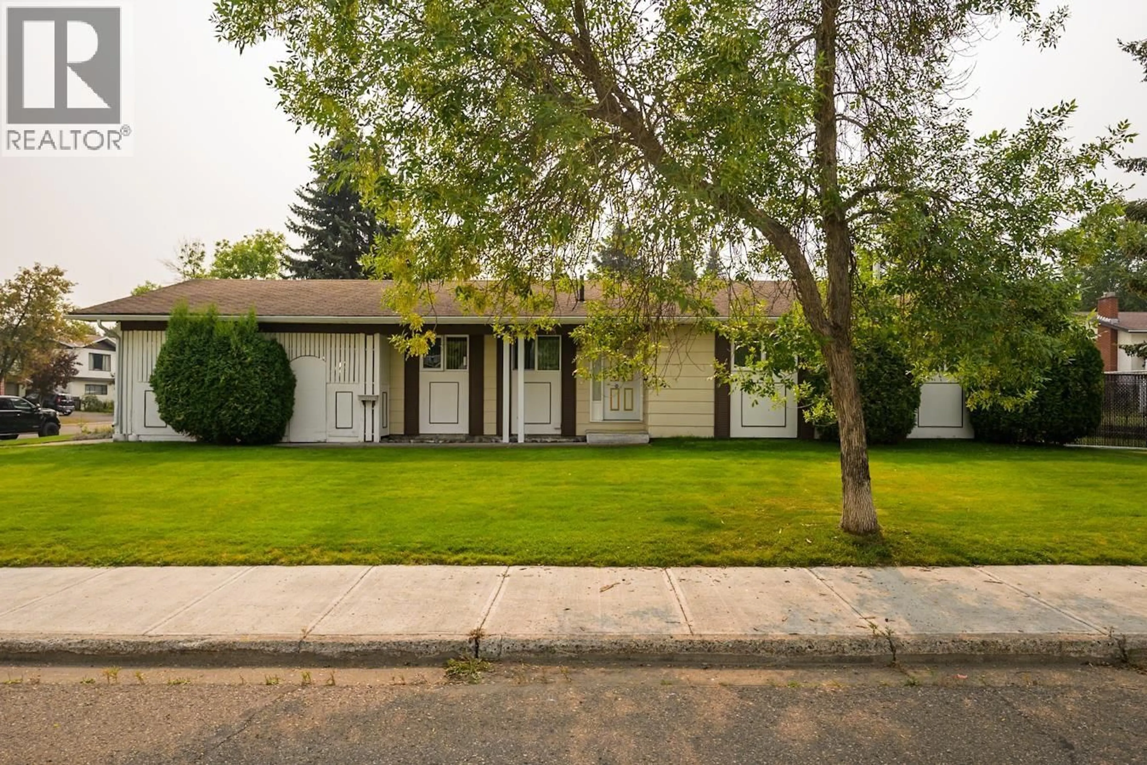 Home with vinyl exterior material, street for 4805 1ST AVENUE, Prince George British Columbia V2M6H2
