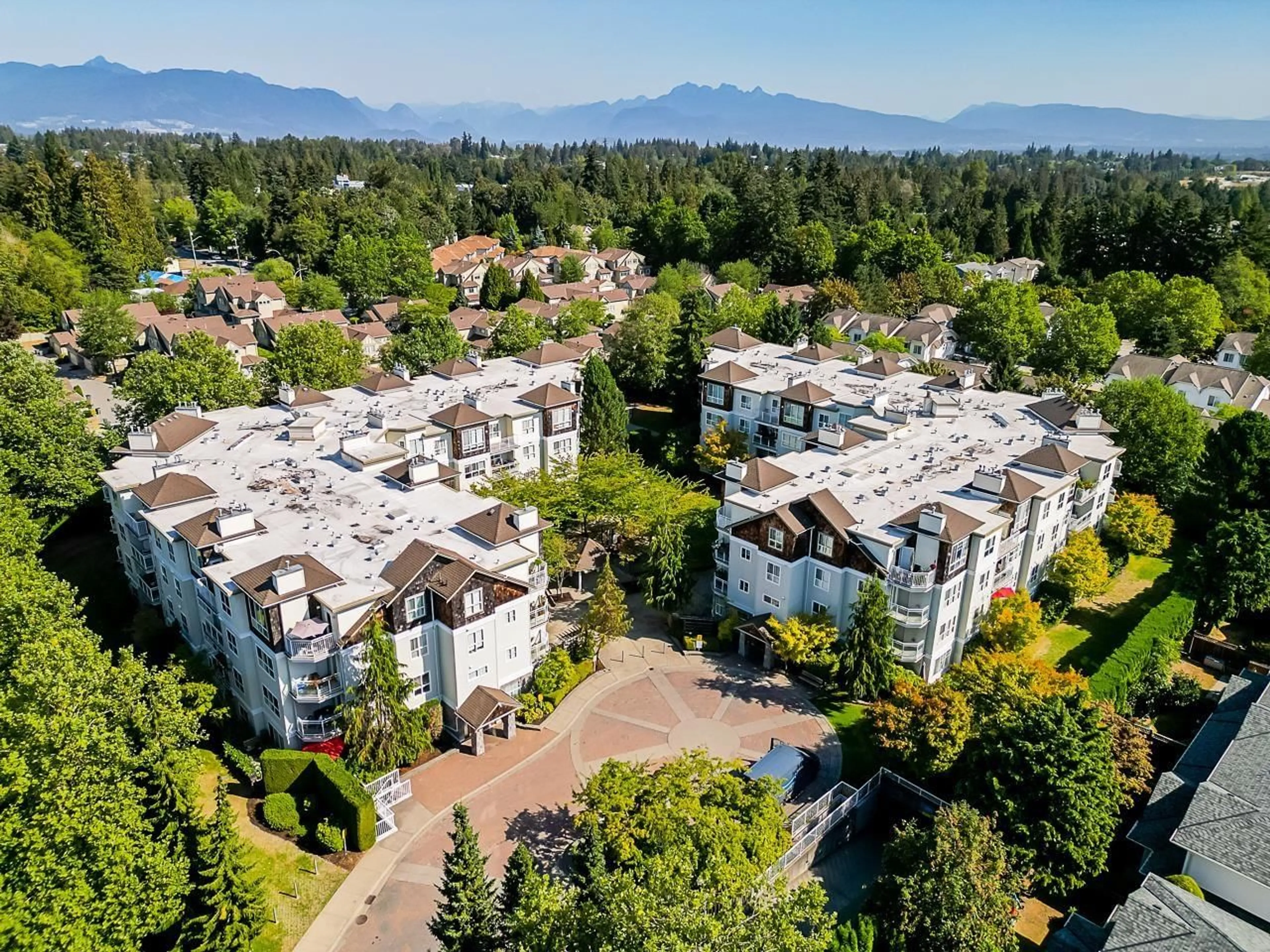 A pic from outside/outdoor area/front of a property/back of a property/a pic from drone, mountain view for 403 - 10188 155, Surrey British Columbia V3R0R6