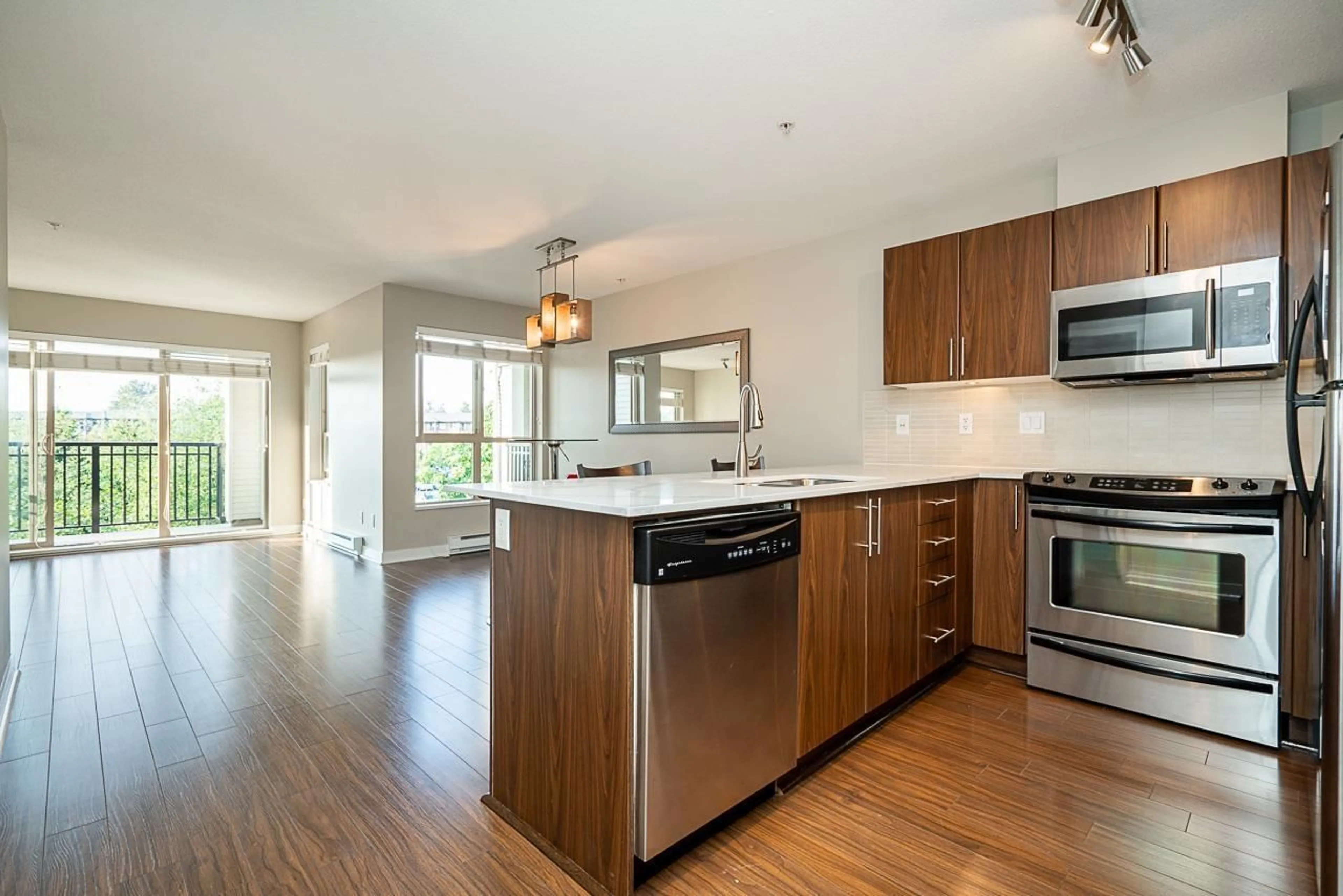 Open concept kitchen, wood/laminate floor for D307 - 8929 202, Langley British Columbia V1M0B4