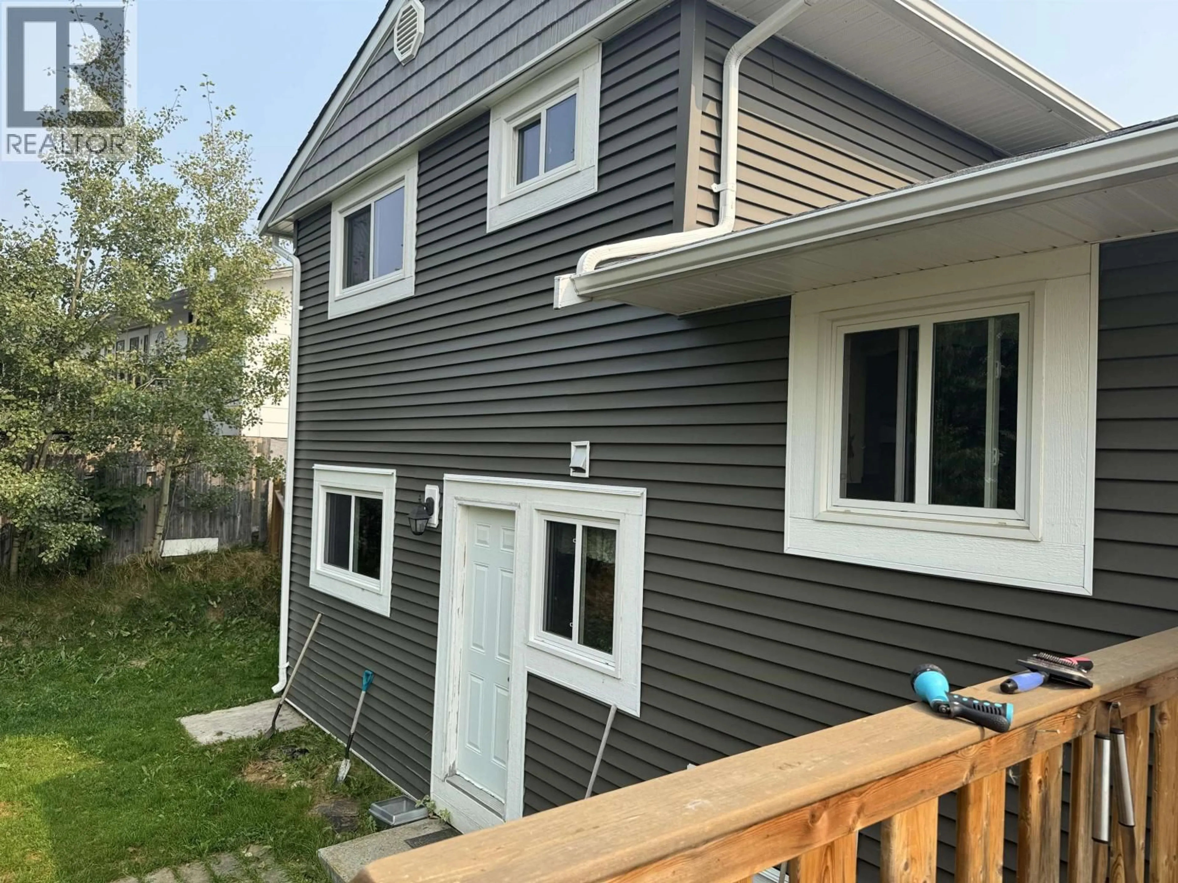 Home with vinyl exterior material, street for 231 CENTENNIAL DRIVE, Mackenzie British Columbia V0C2C0
