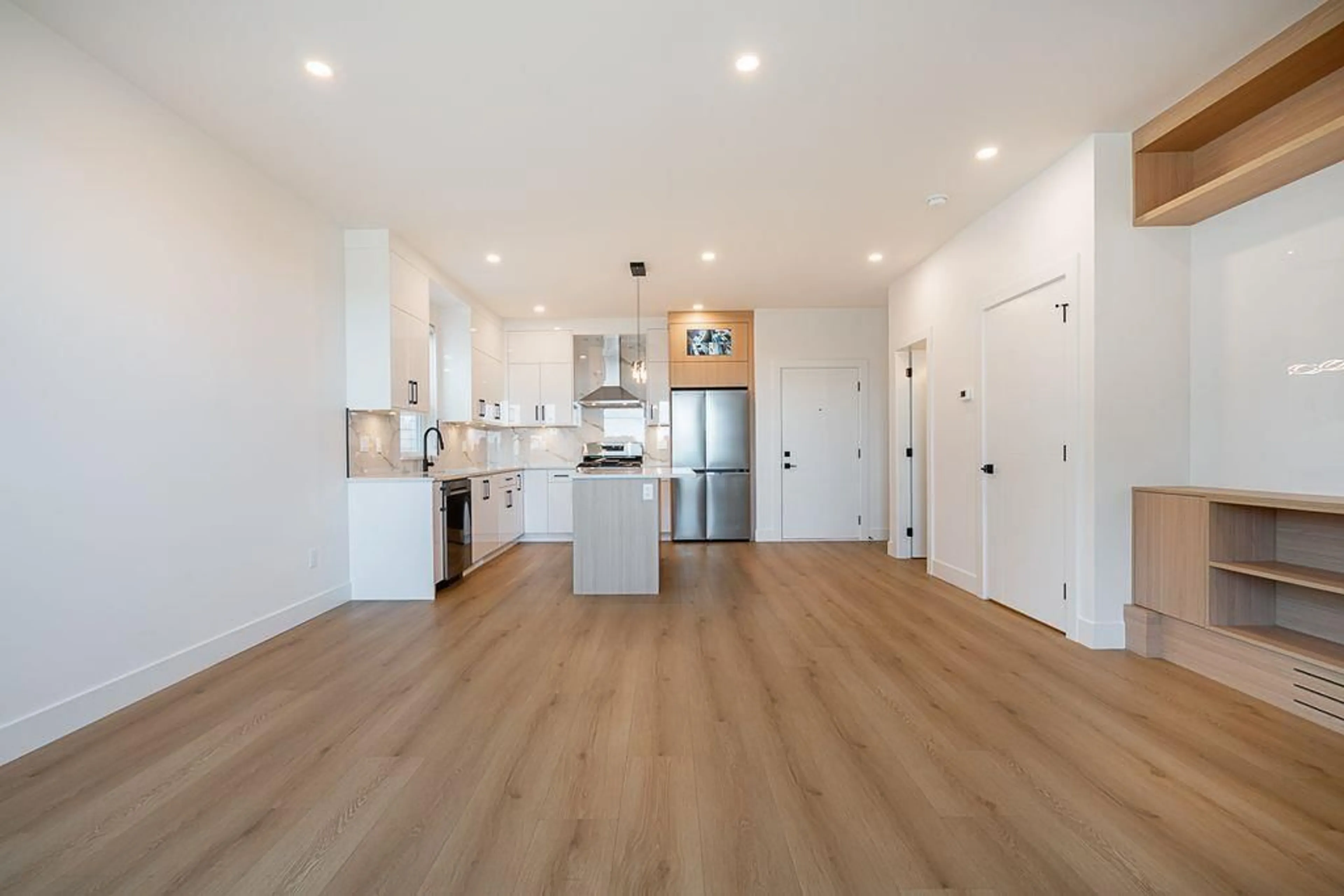 Open concept kitchen, wood/laminate floor for 101 - 16697 16, Surrey British Columbia V3S9X7