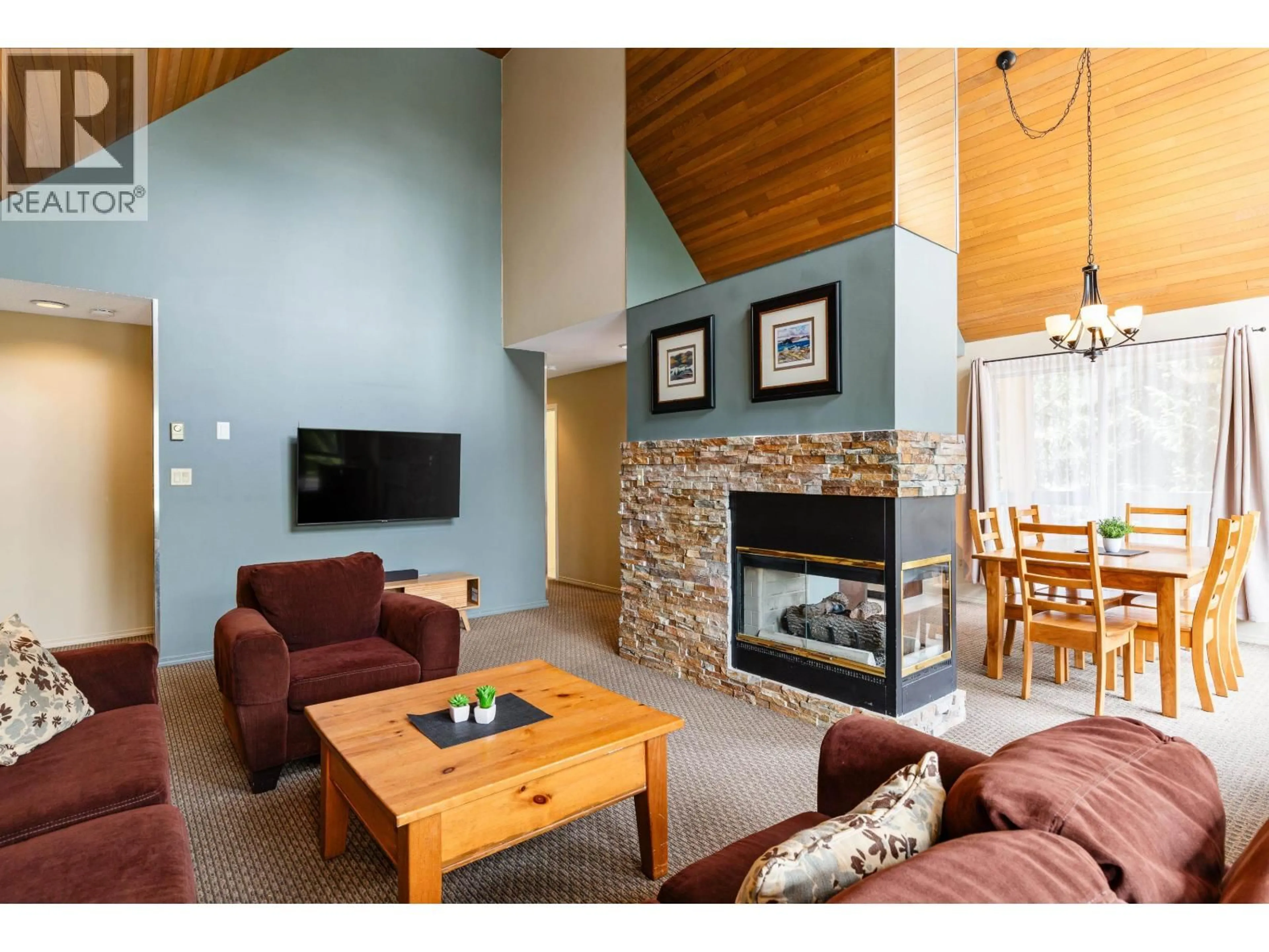 Living room with furniture, wood/laminate floor for 208 - 4865 PAINTED CLIFF ROAD, Whistler British Columbia V8E1C8