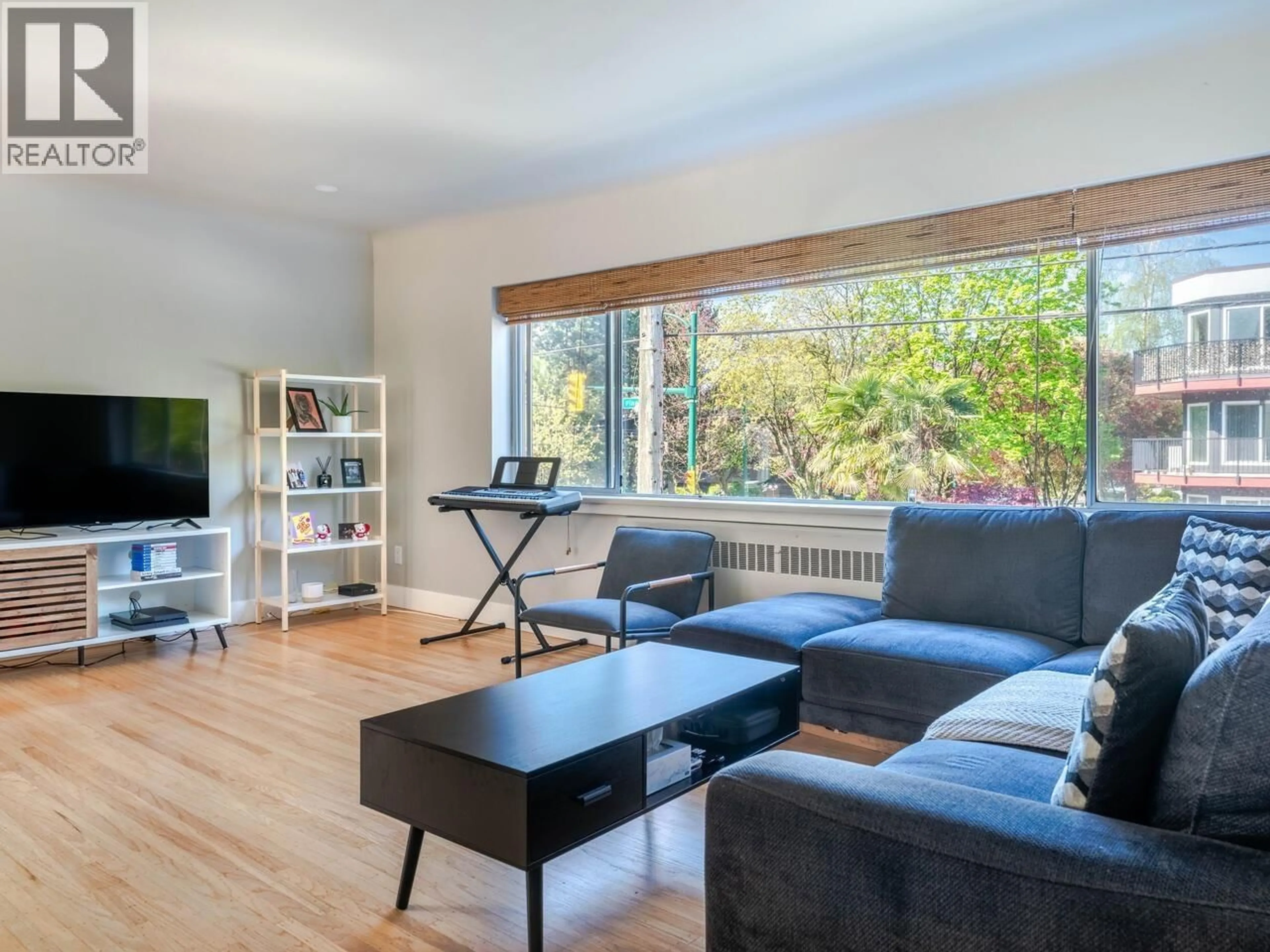 Living room with furniture, wood/laminate floor for 103 - 2776 PINE STREET, Vancouver British Columbia V6J3G2